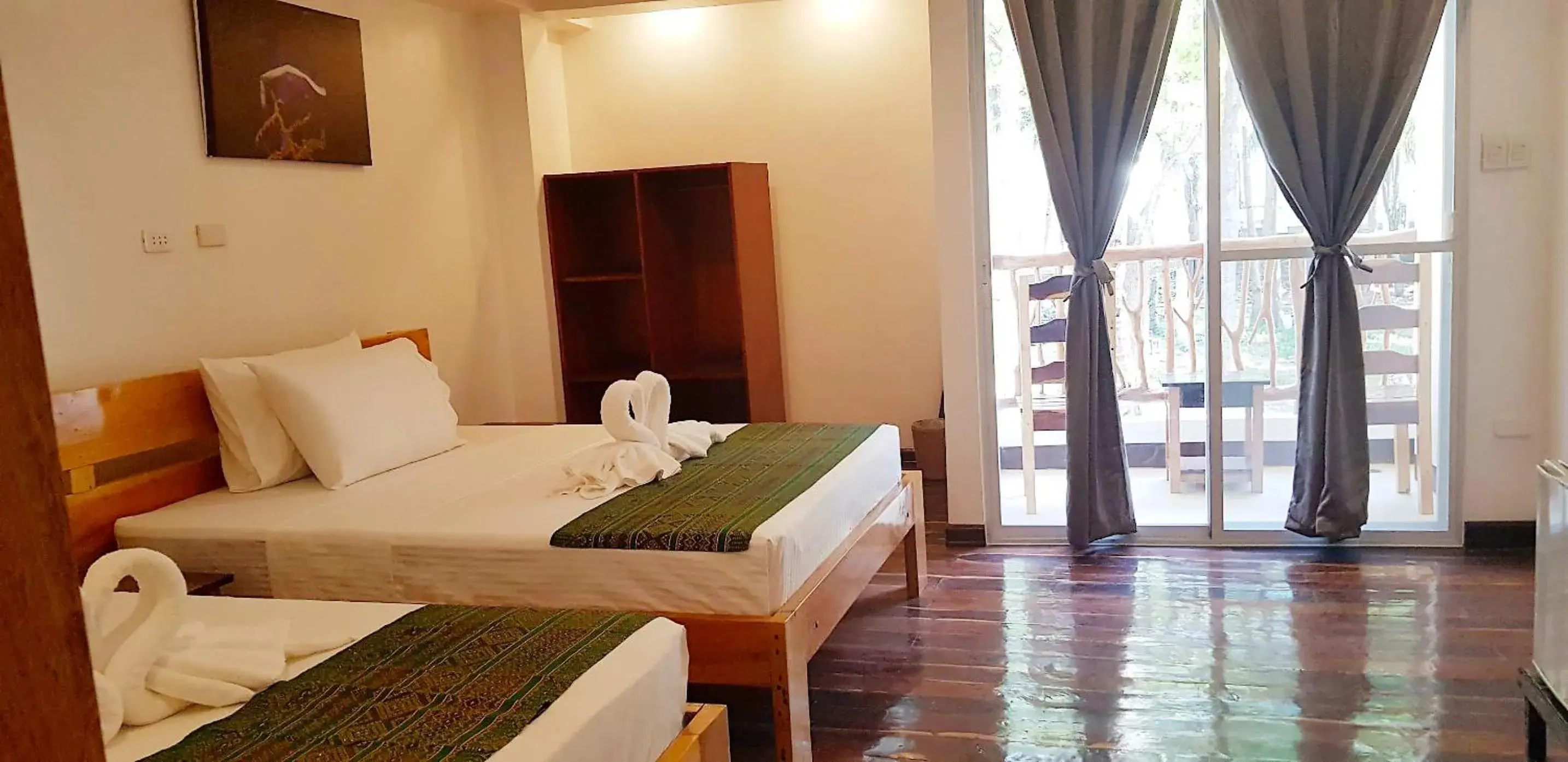 Bed in DiveGurus Boracay Beach Resort Bed in DiveGurus Boracay Beach Resort