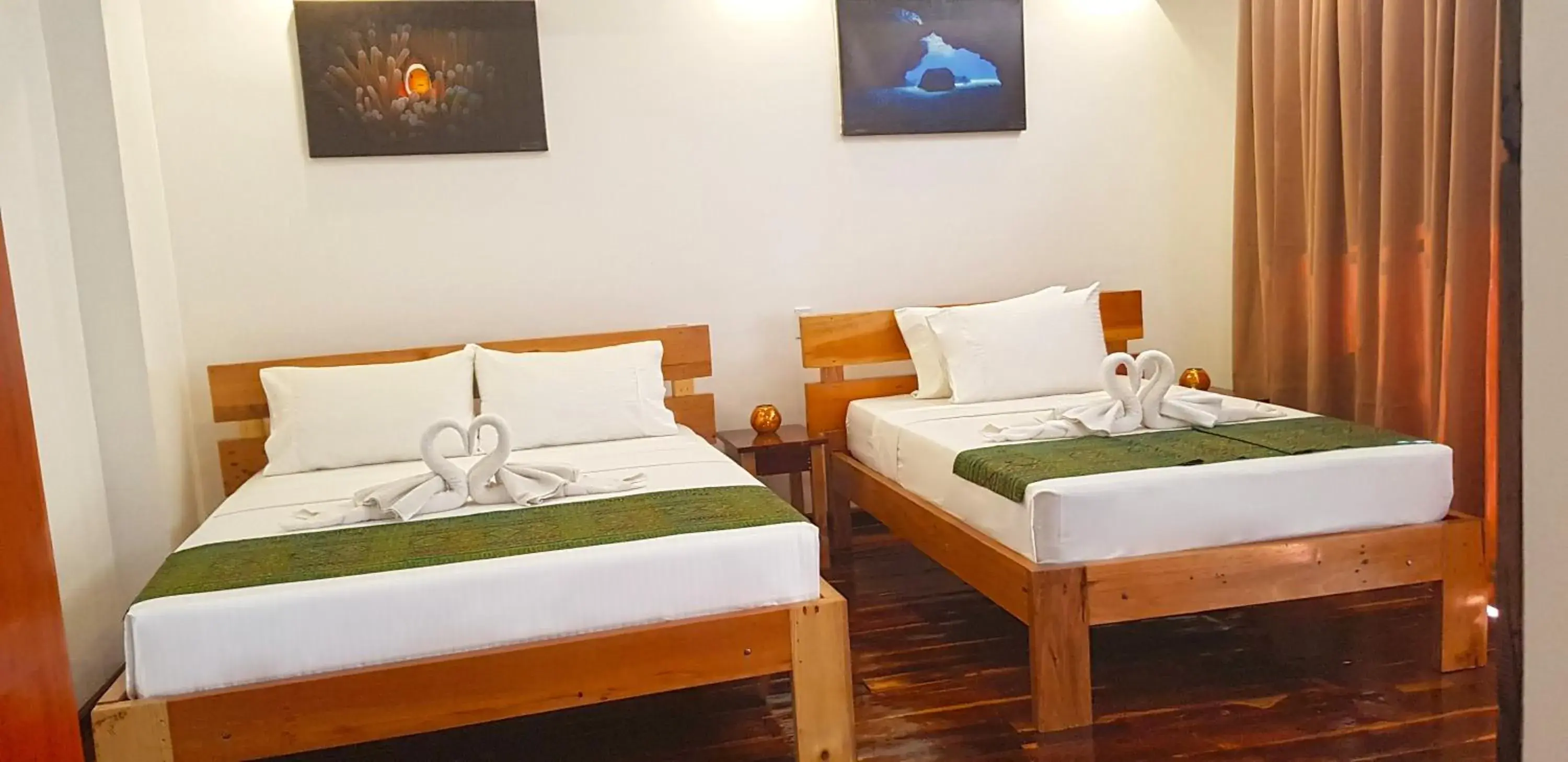 Bed in DiveGurus Boracay Beach Resort Bed in DiveGurus Boracay Beach Resort