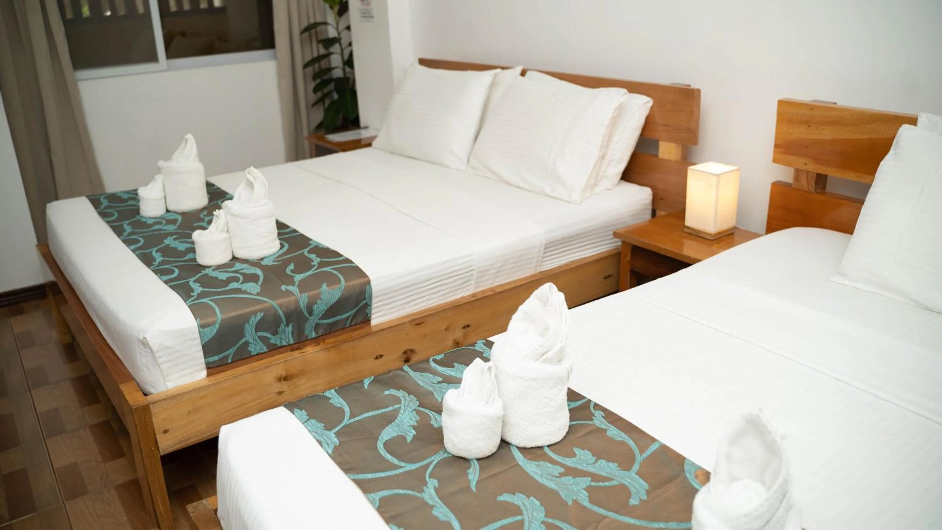 Bed in DiveGurus Boracay Beach Resort