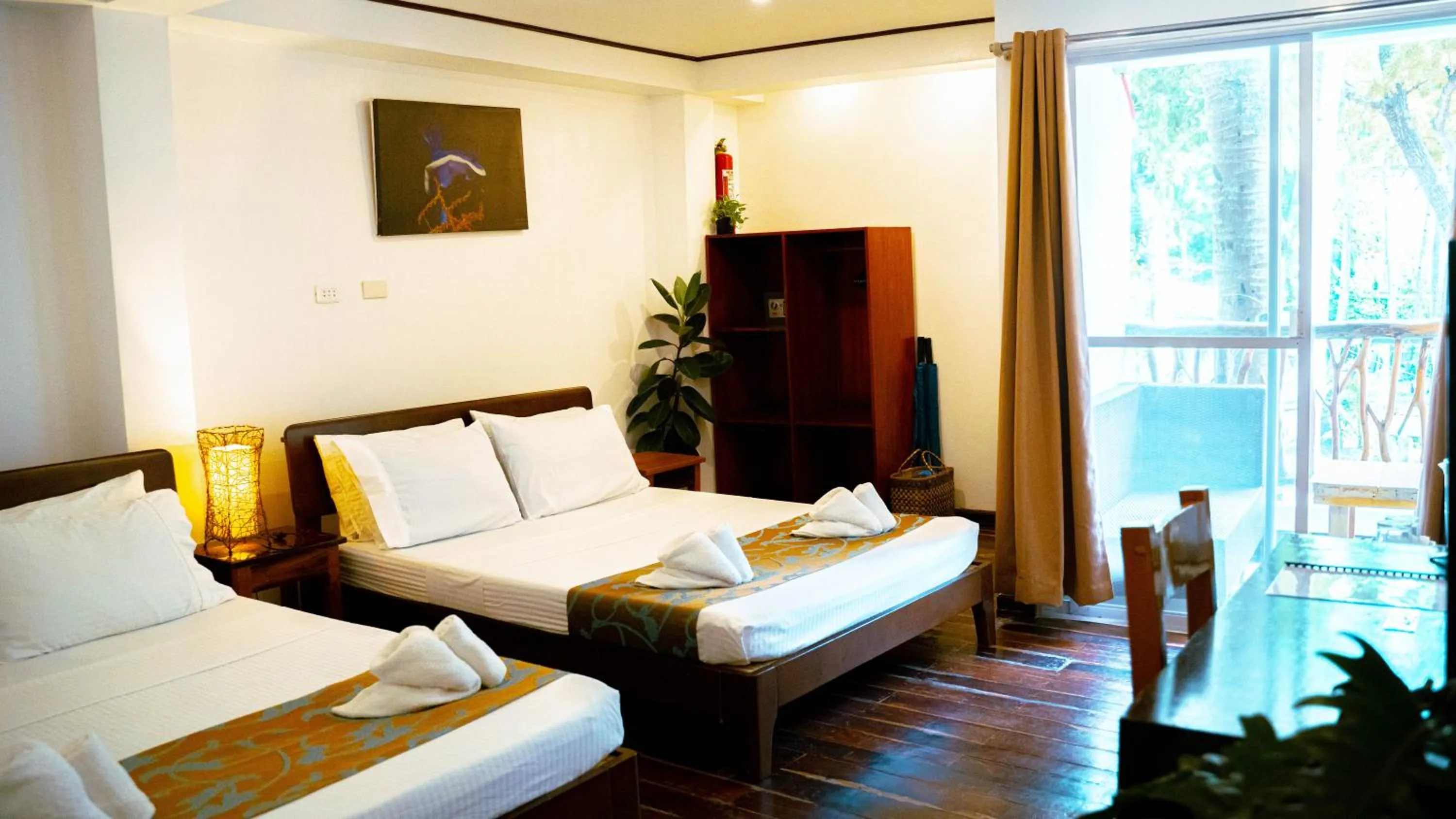 Bed in DiveGurus Boracay Beach Resort