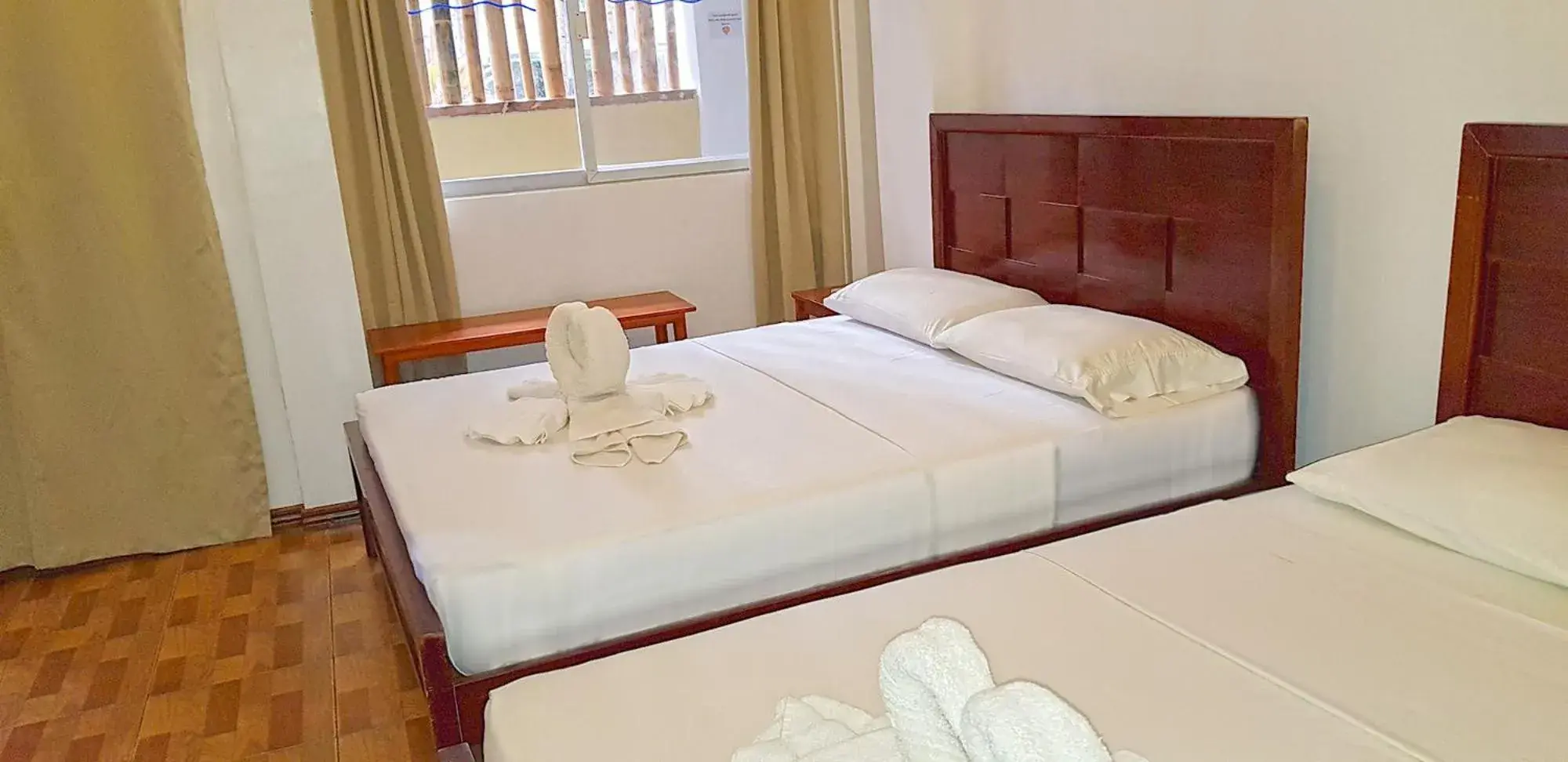 Bed in DiveGurus Boracay Beach Resort Bed in DiveGurus Boracay Beach Resort