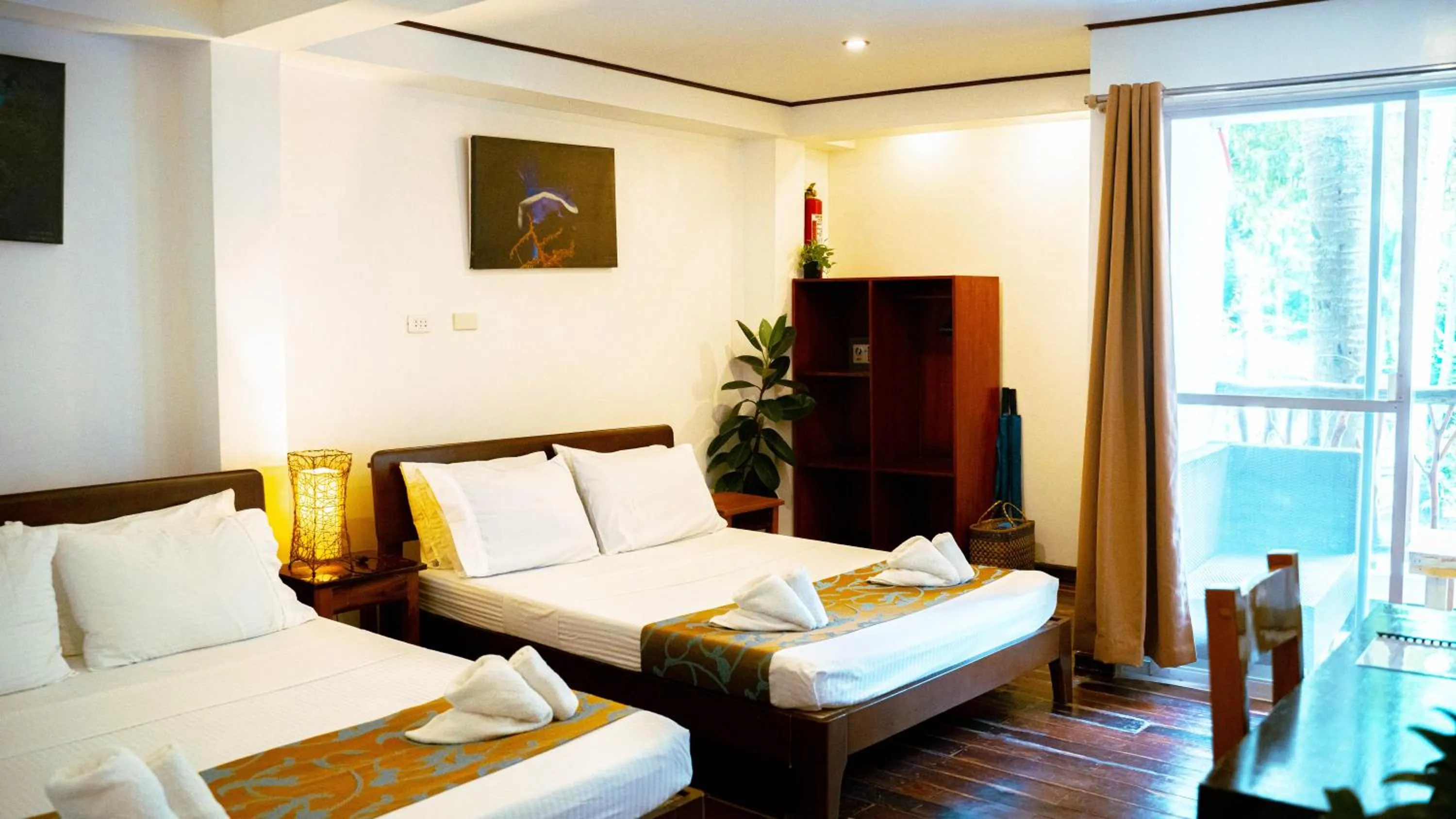 Bed in DiveGurus Boracay Beach Resort