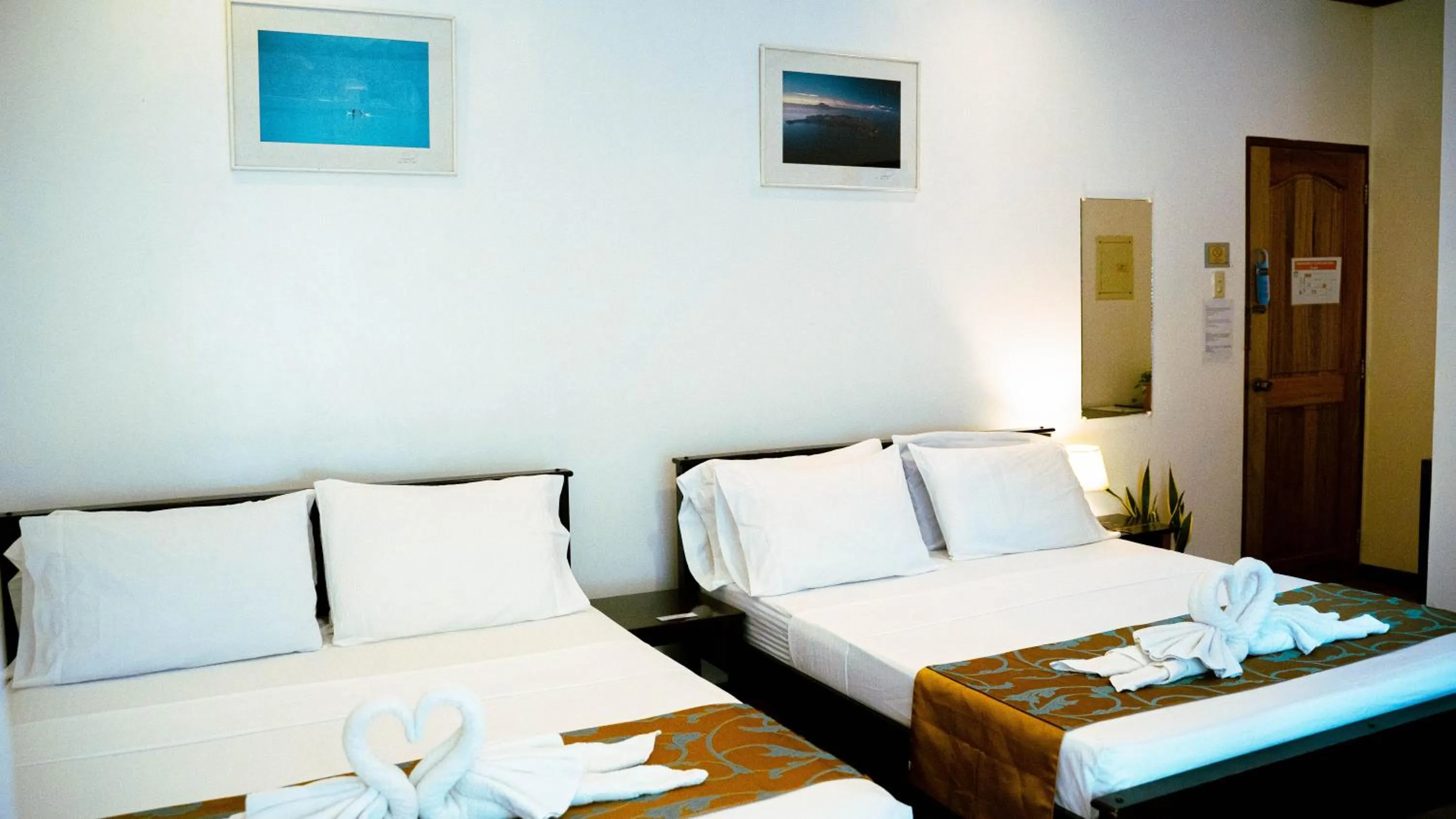 Bed in DiveGurus Boracay Beach Resort