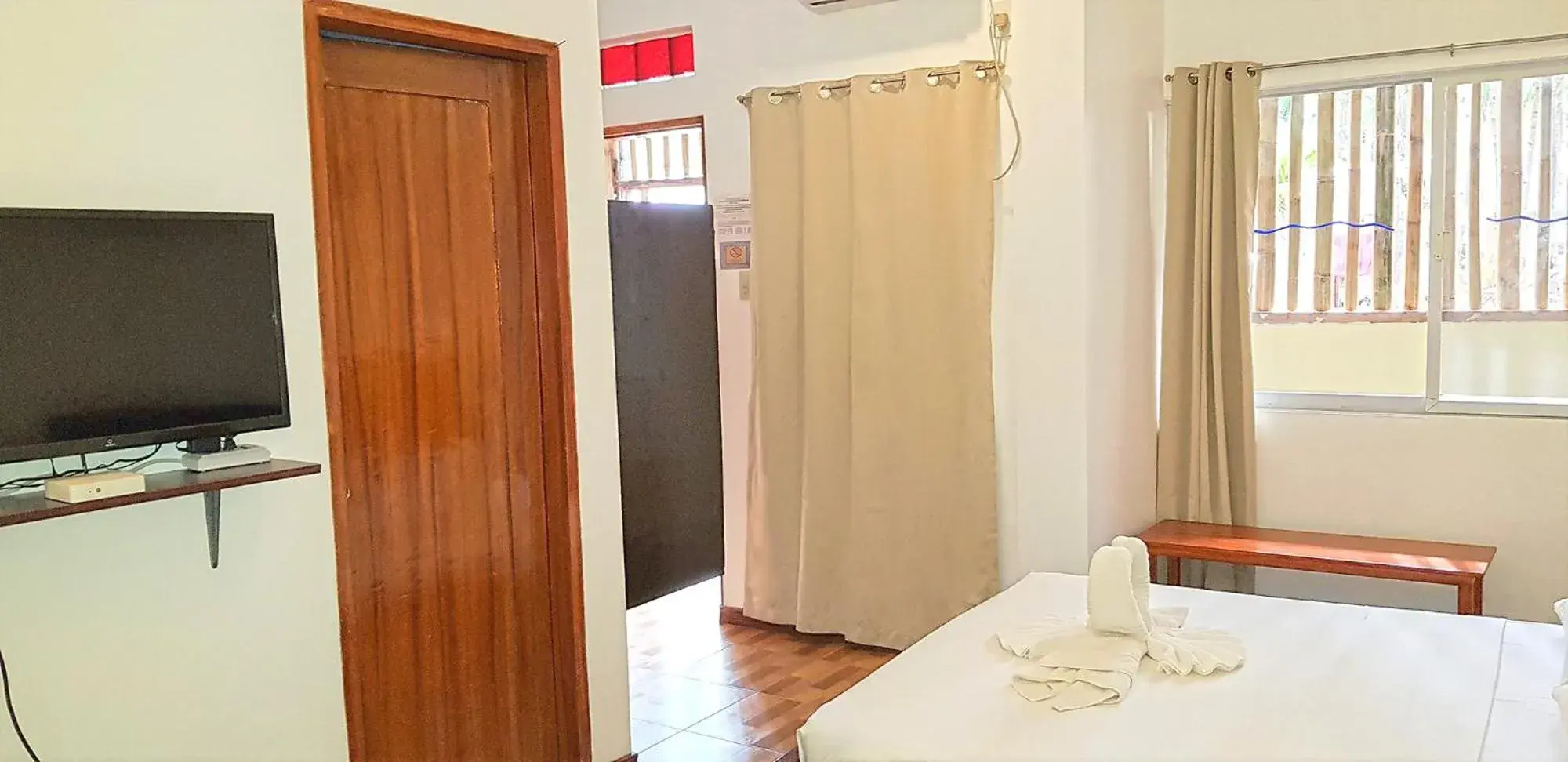 TV and multimedia, Bed in DiveGurus Boracay Beach Resort TV and multimedia, Bed in DiveGurus Boracay Beach Resort