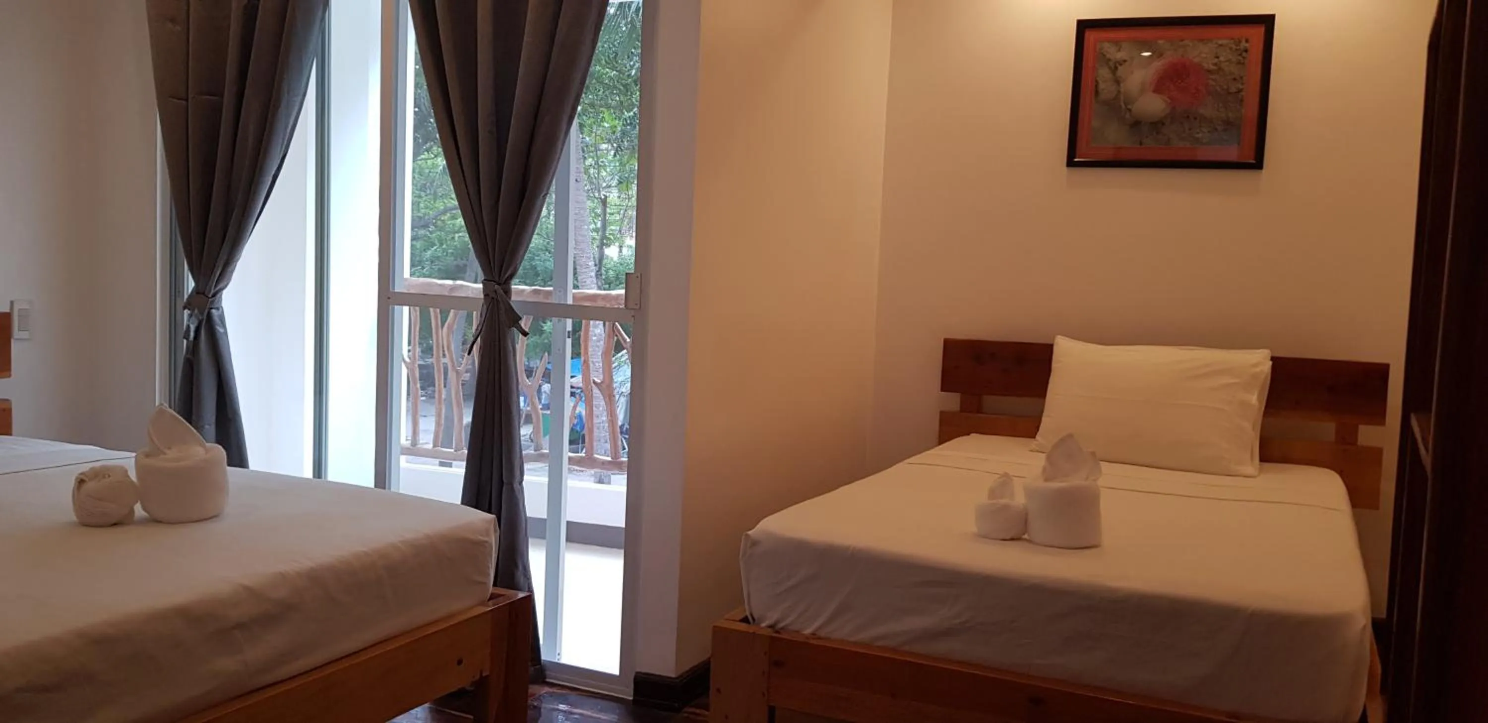 Bed in DiveGurus Boracay Beach Resort