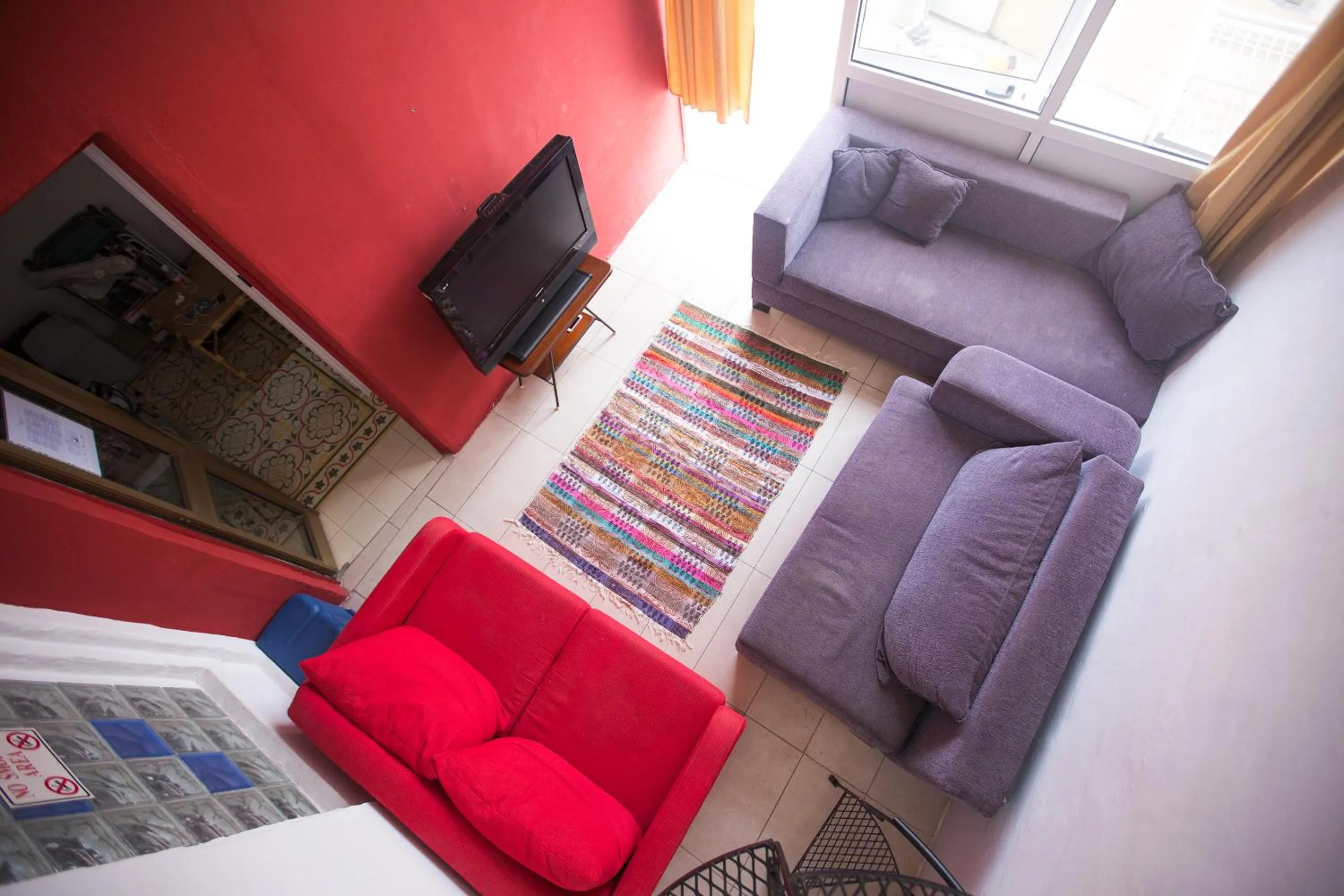 Communal lounge/ TV room in Granny's Inn Hostel