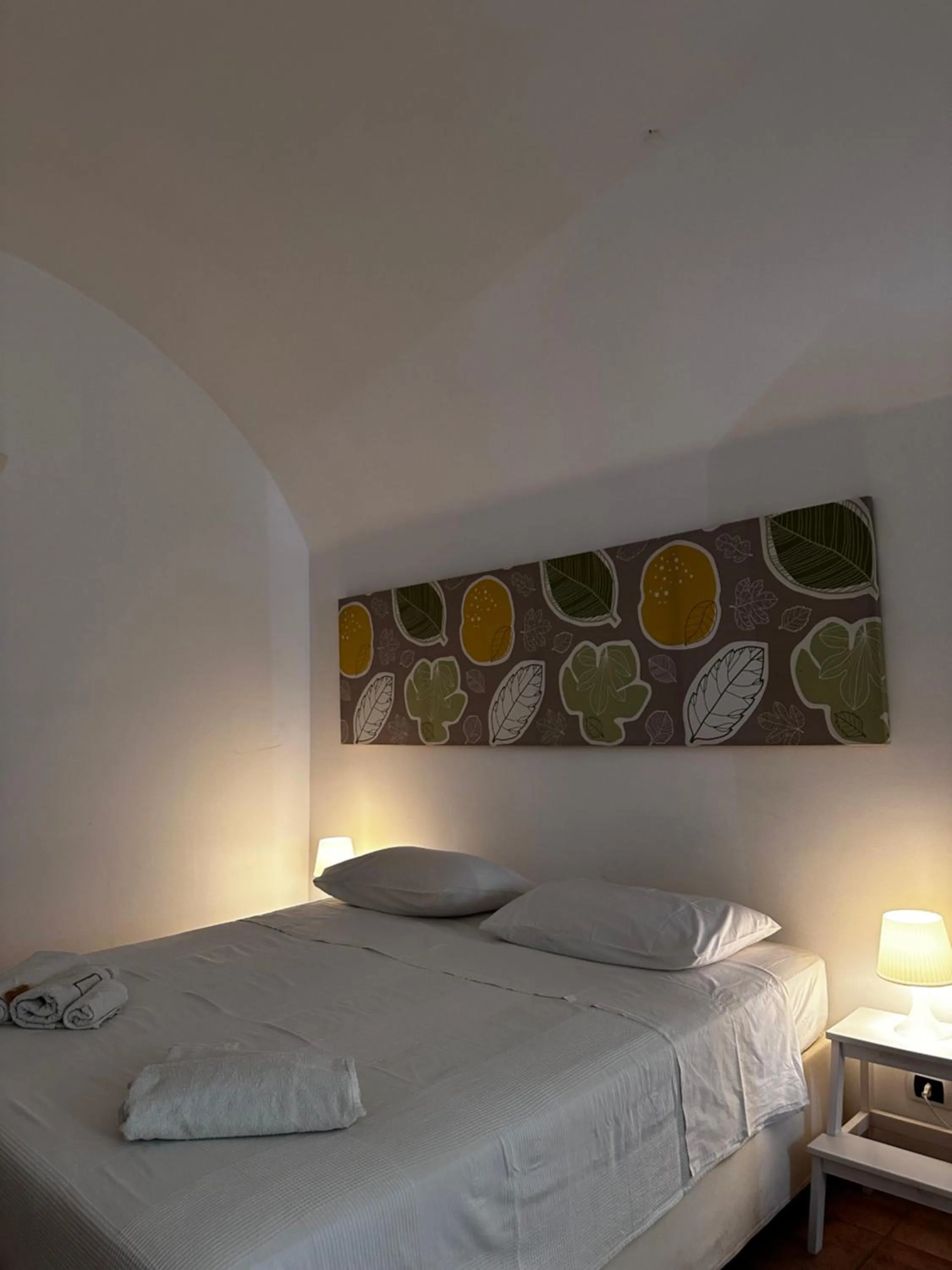 Bed in La Torre e il Mare Rooms by STHEY