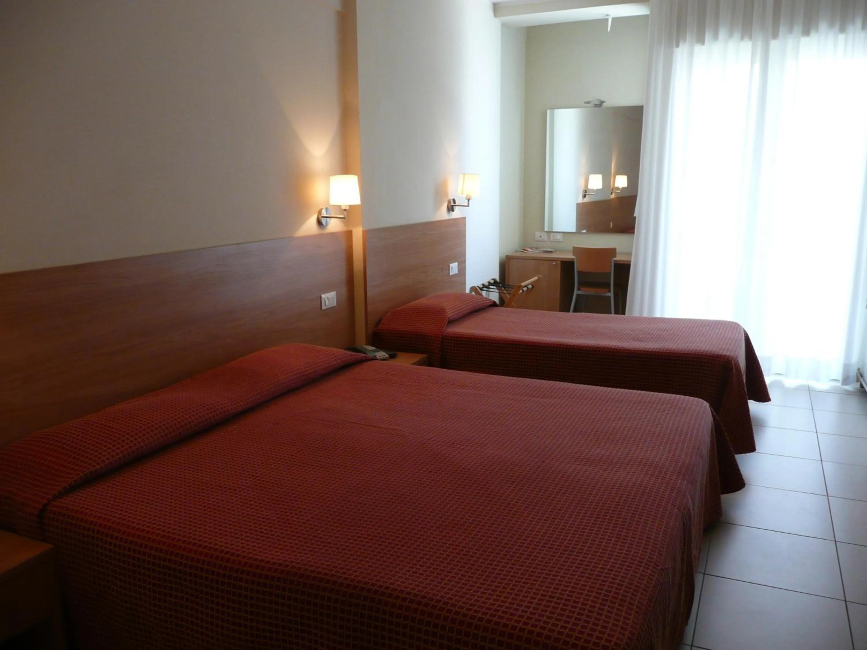 Bedroom, Bed in Hotel Majorca sul Mare in centro a Riccione con Area Fitness