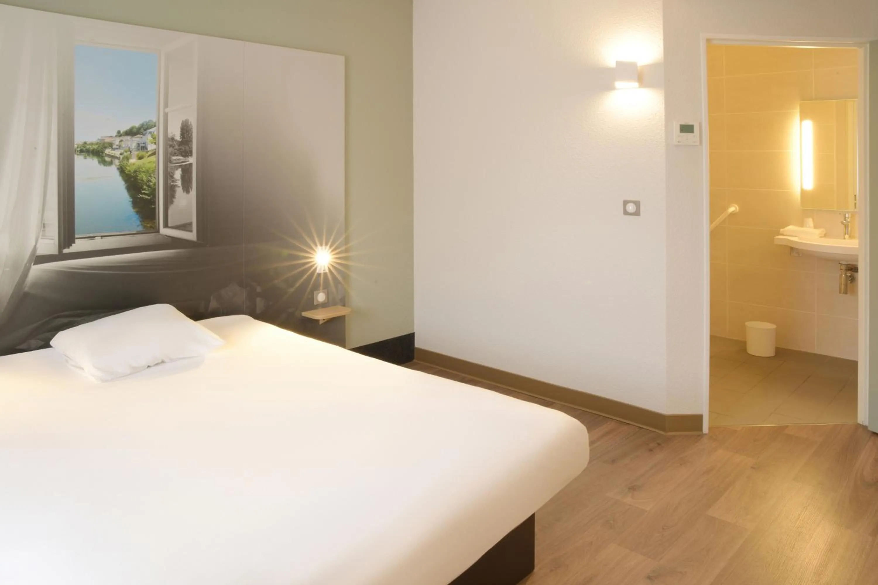 Photo of the whole room, Bed in B&B HOTEL Angoulême