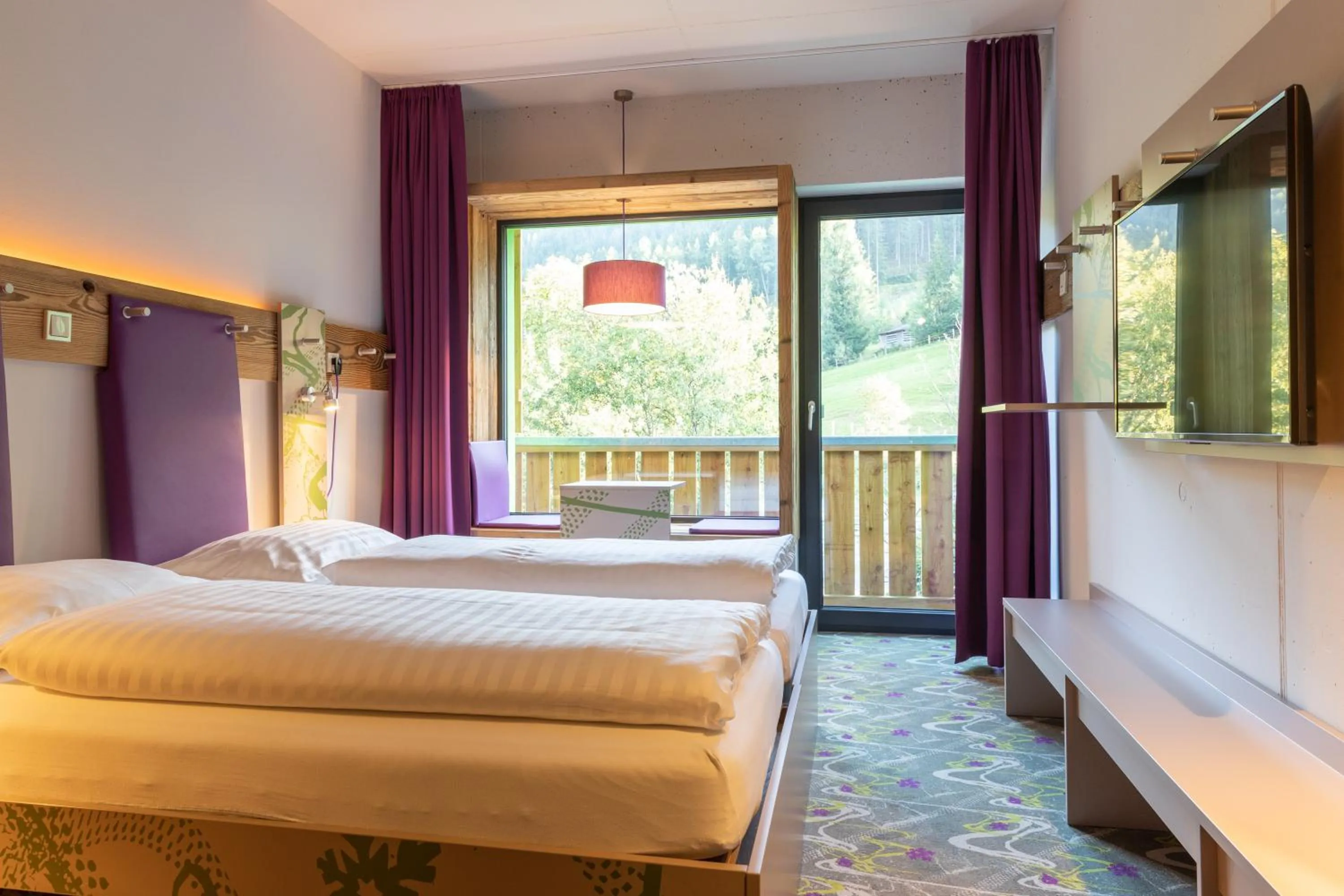 Photo of the whole room, Bed in Explorer Hotel Bad Kleinkirchheim