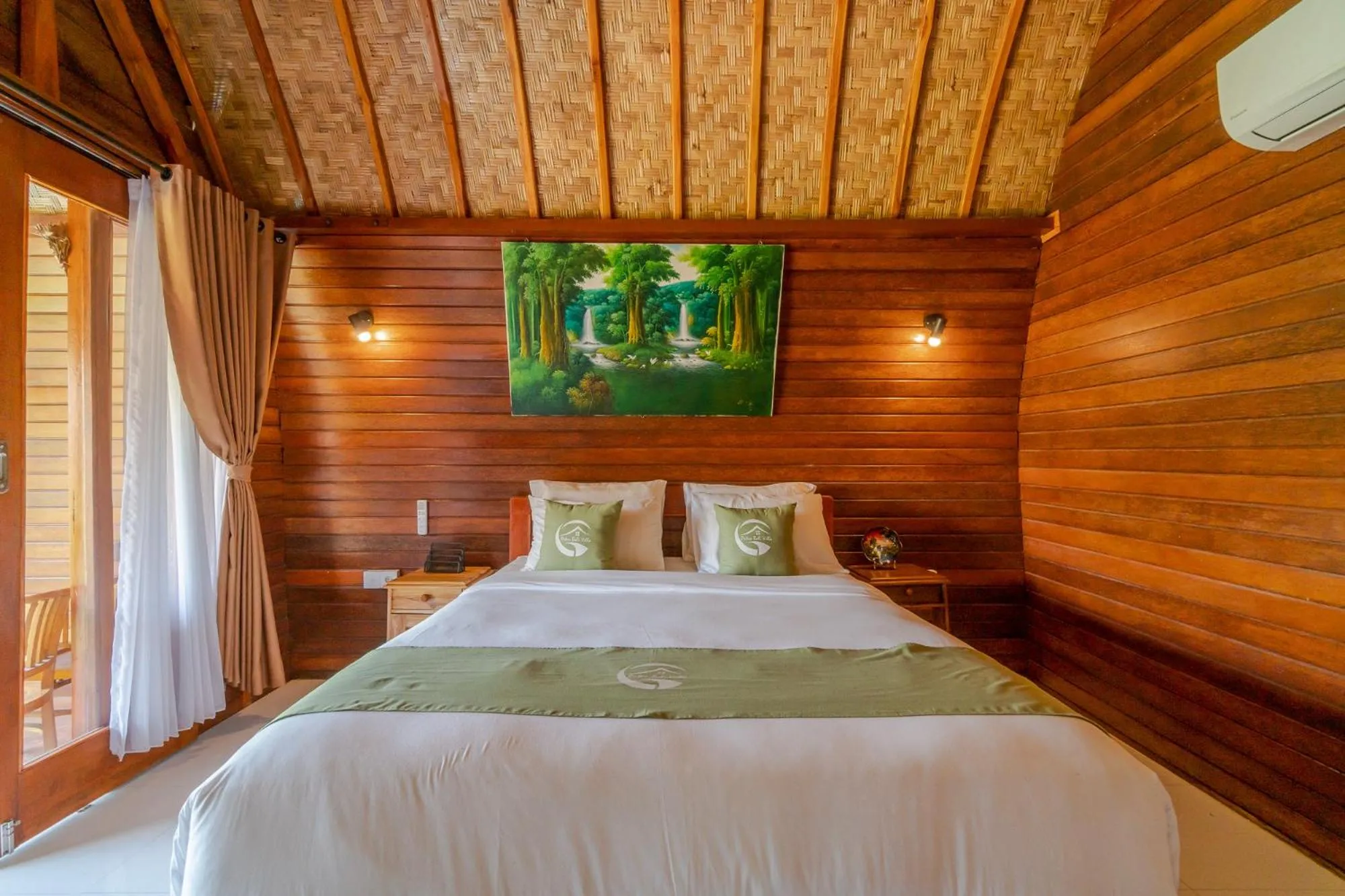 Bed in Putra Bali Villa by Bukit Vista