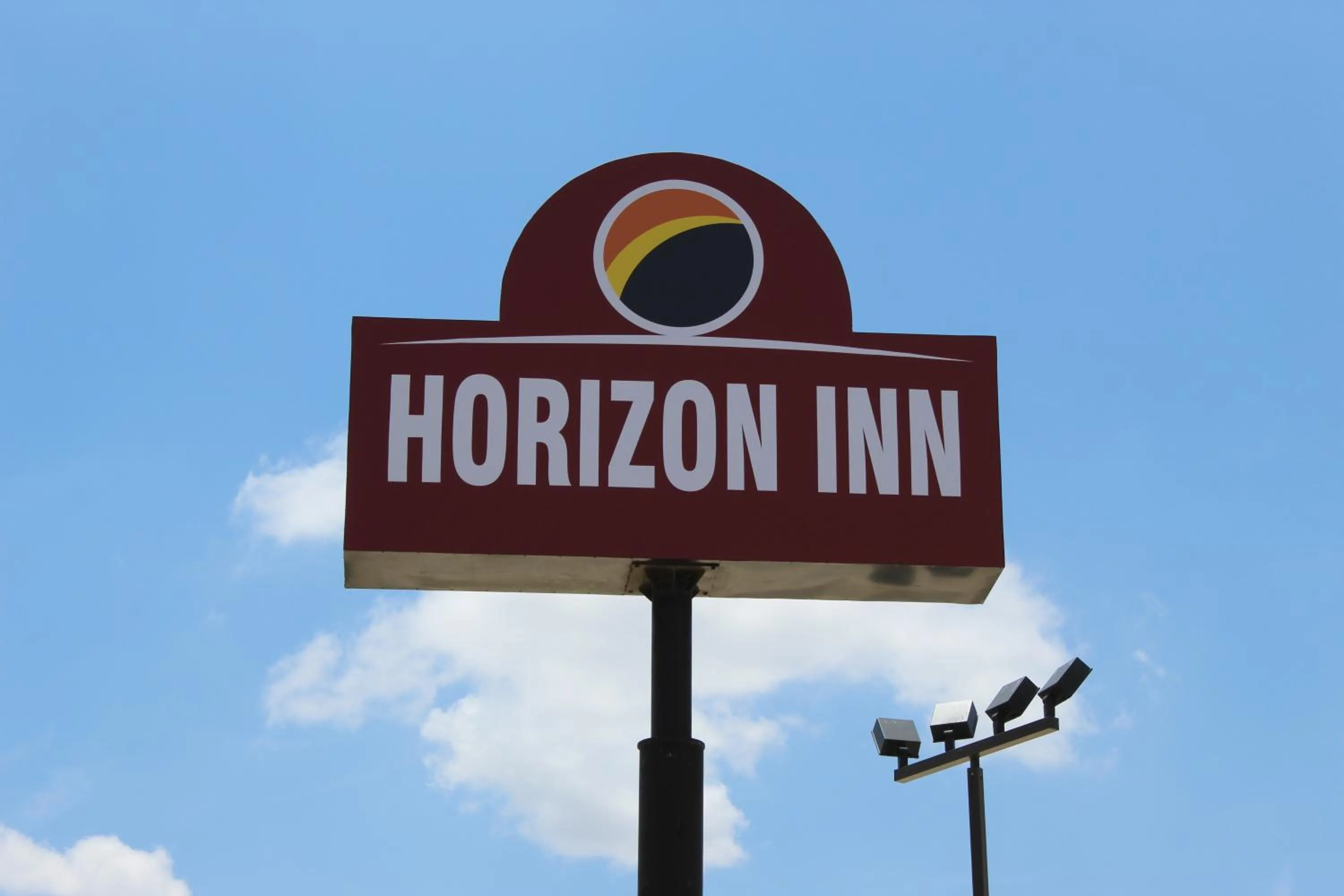 Property logo or sign in Horizon Inn & Suites