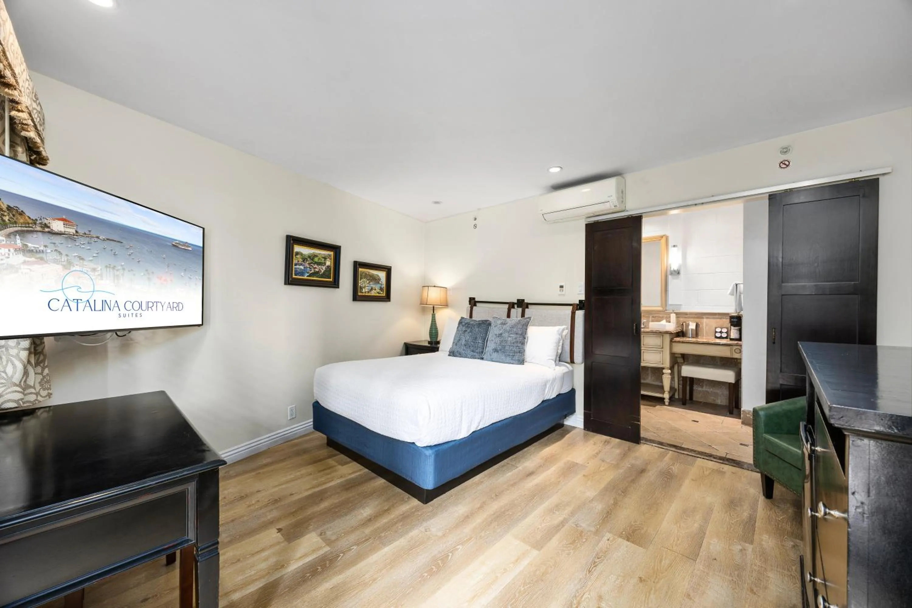 Bed in Catalina Courtyard Suites