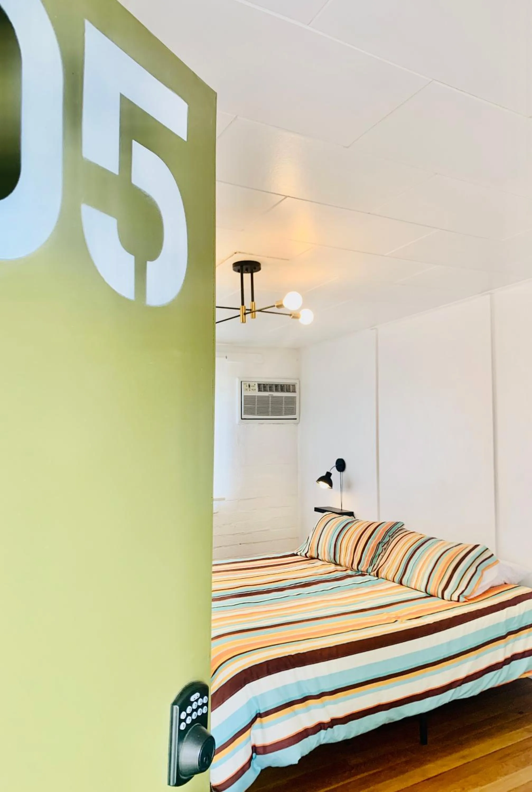 Bed in Dragonfly Motor Lodge