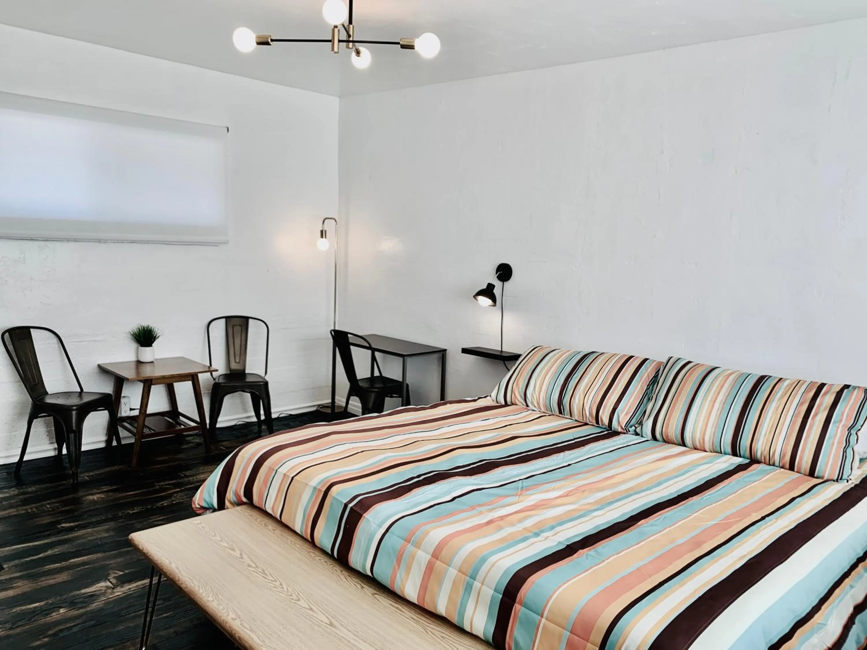 Bed in Dragonfly Motor Lodge