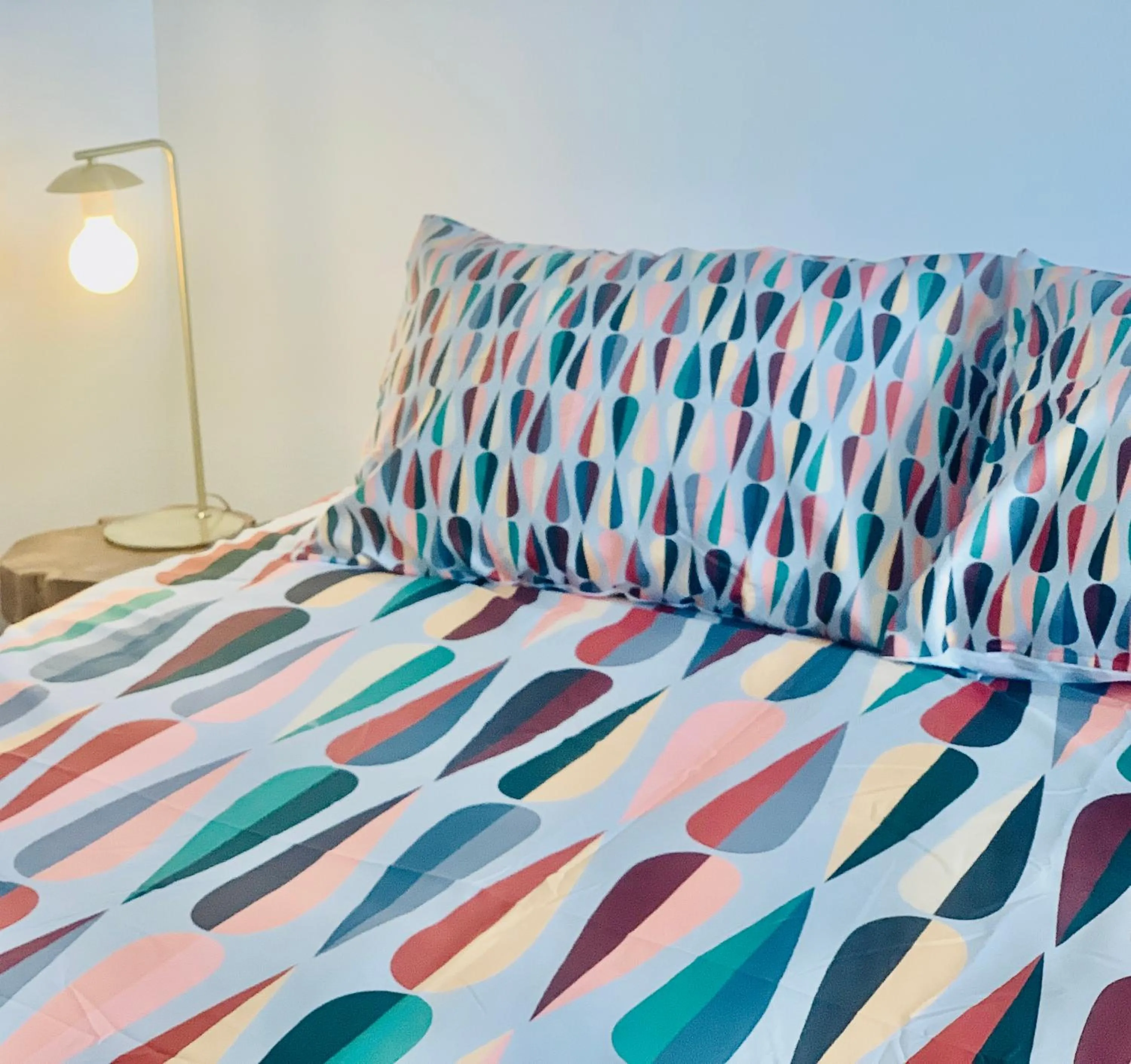 Bed in Dragonfly Motor Lodge