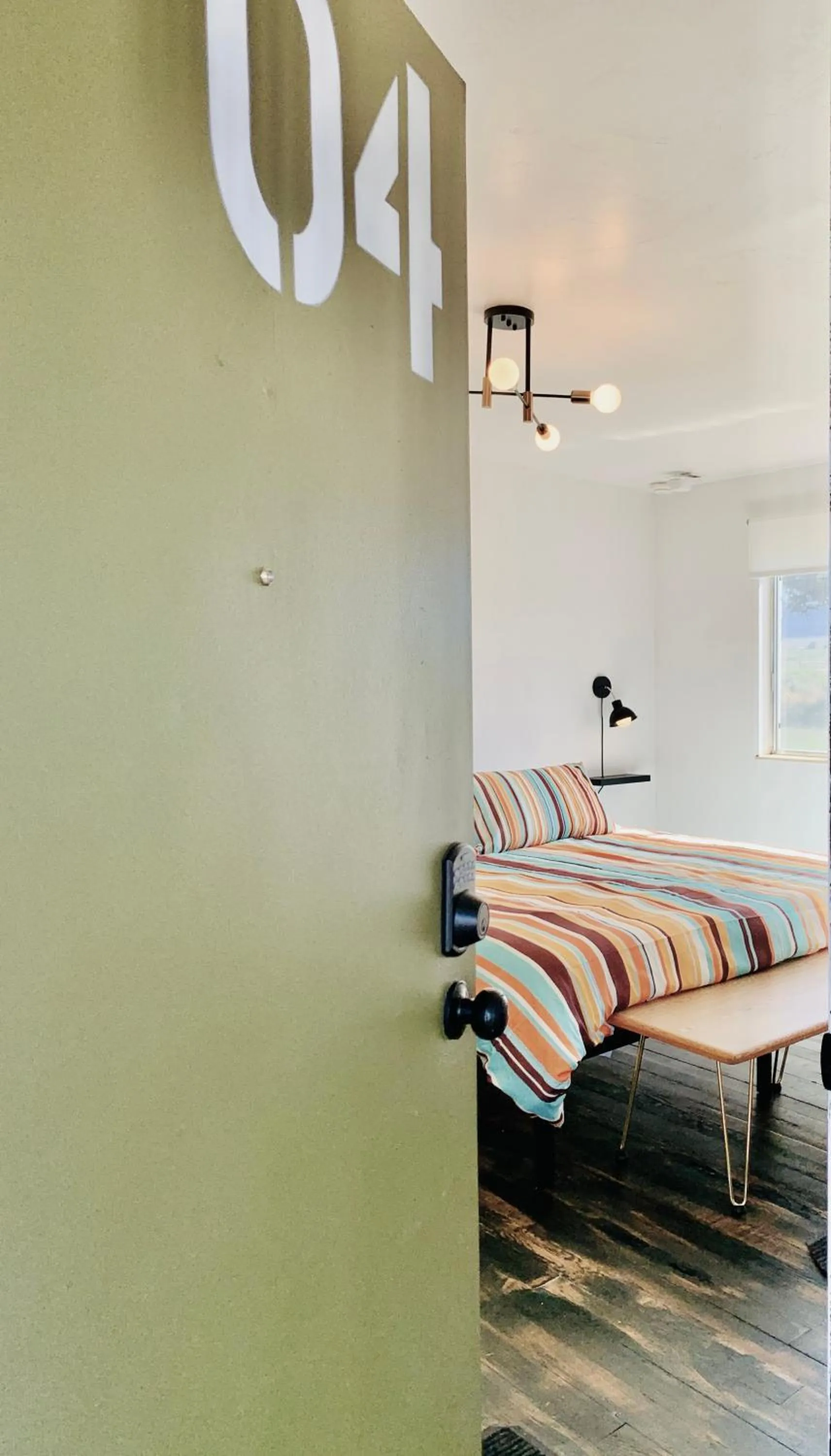 Bed in Dragonfly Motor Lodge