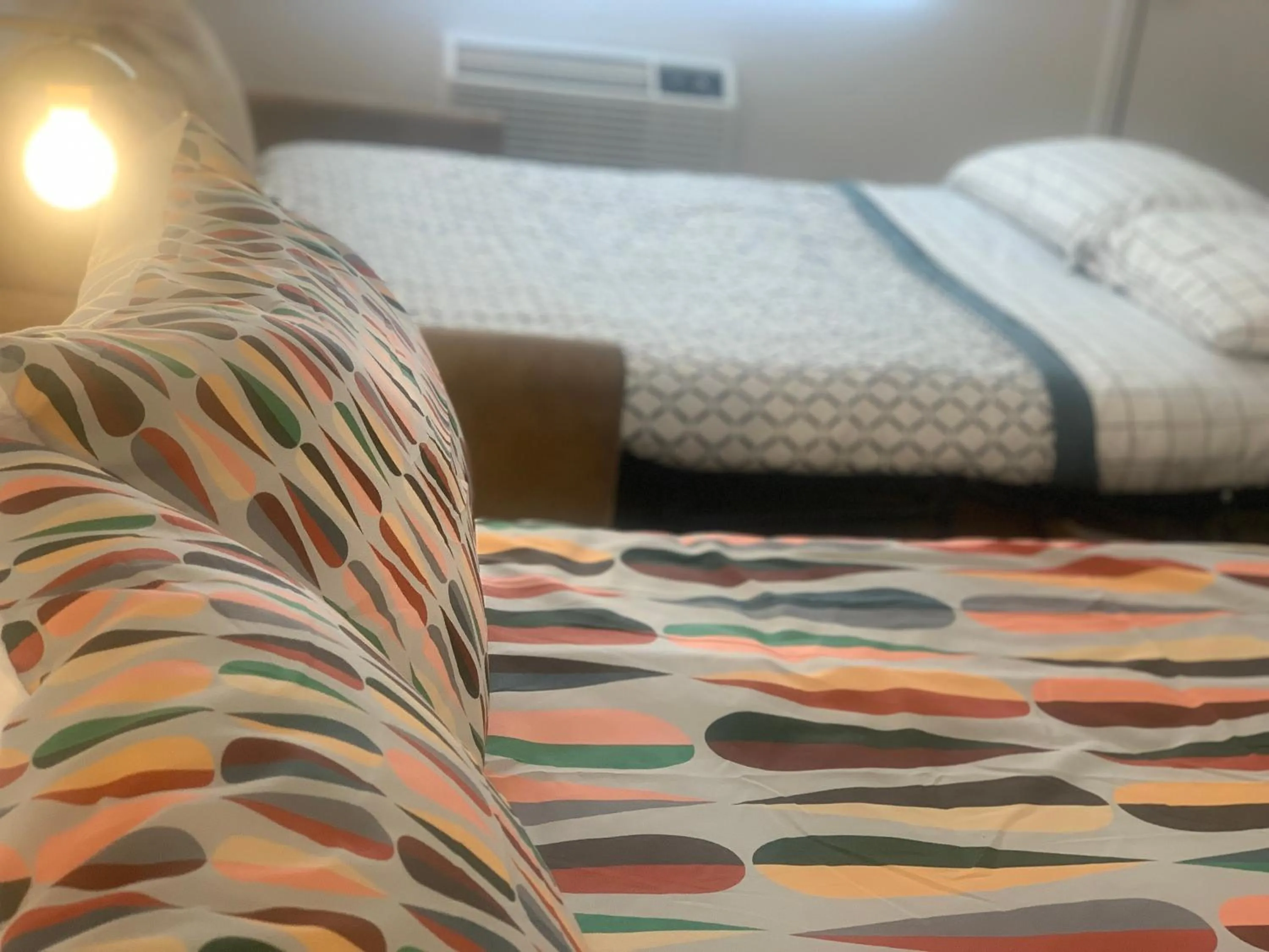 Bed in Dragonfly Motor Lodge