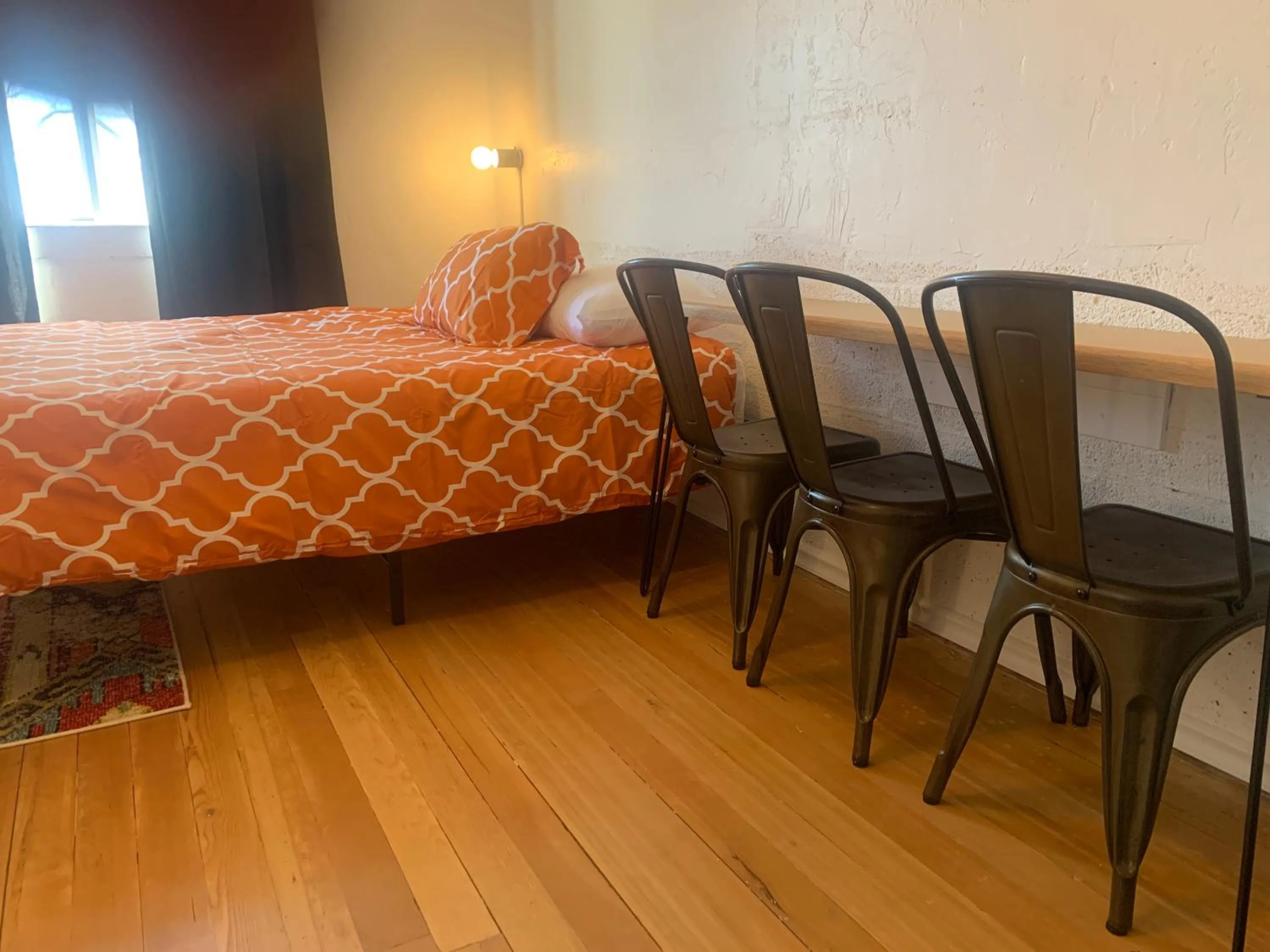 Bed in Dragonfly Motor Lodge