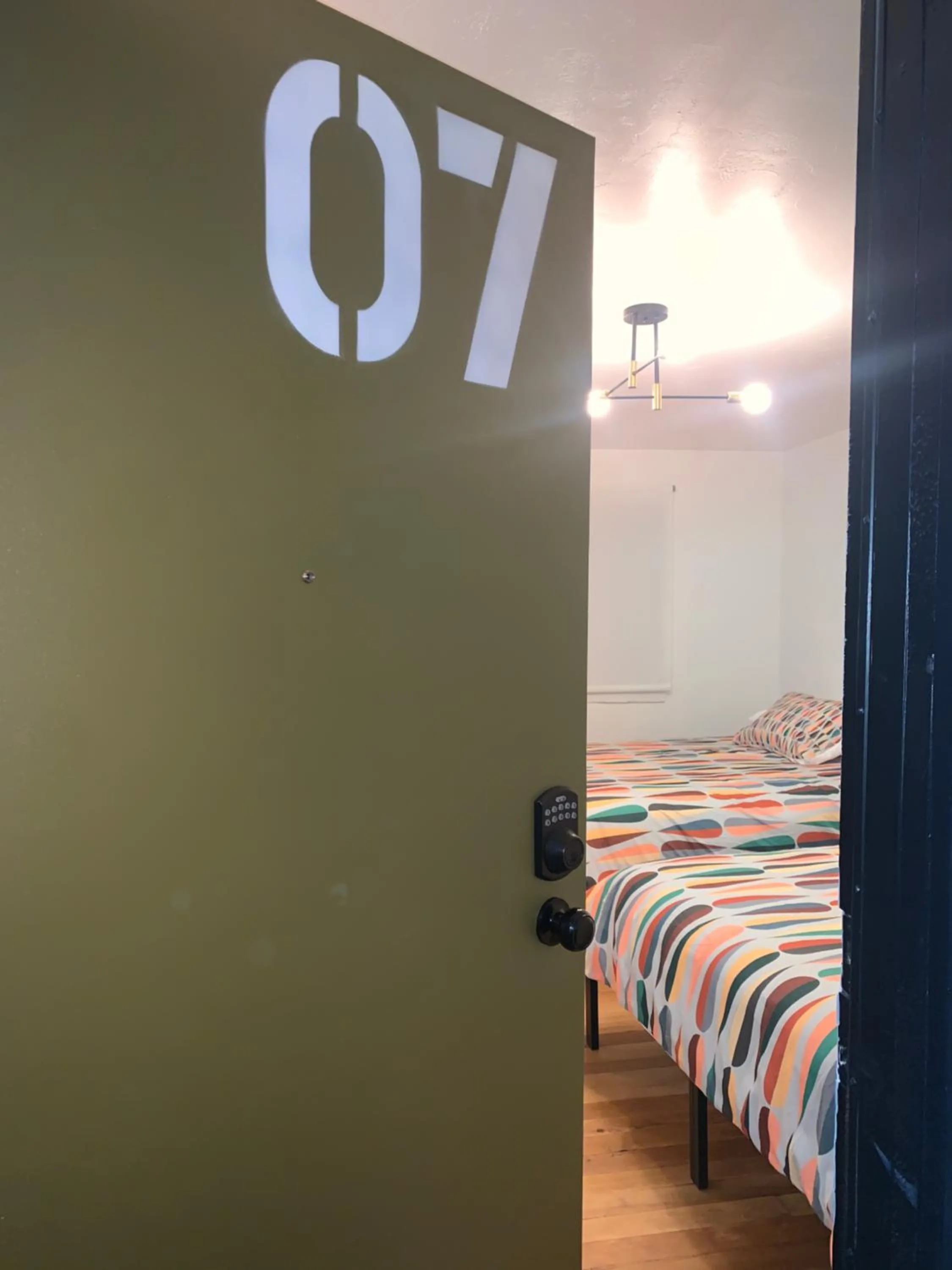 Bed in Dragonfly Motor Lodge