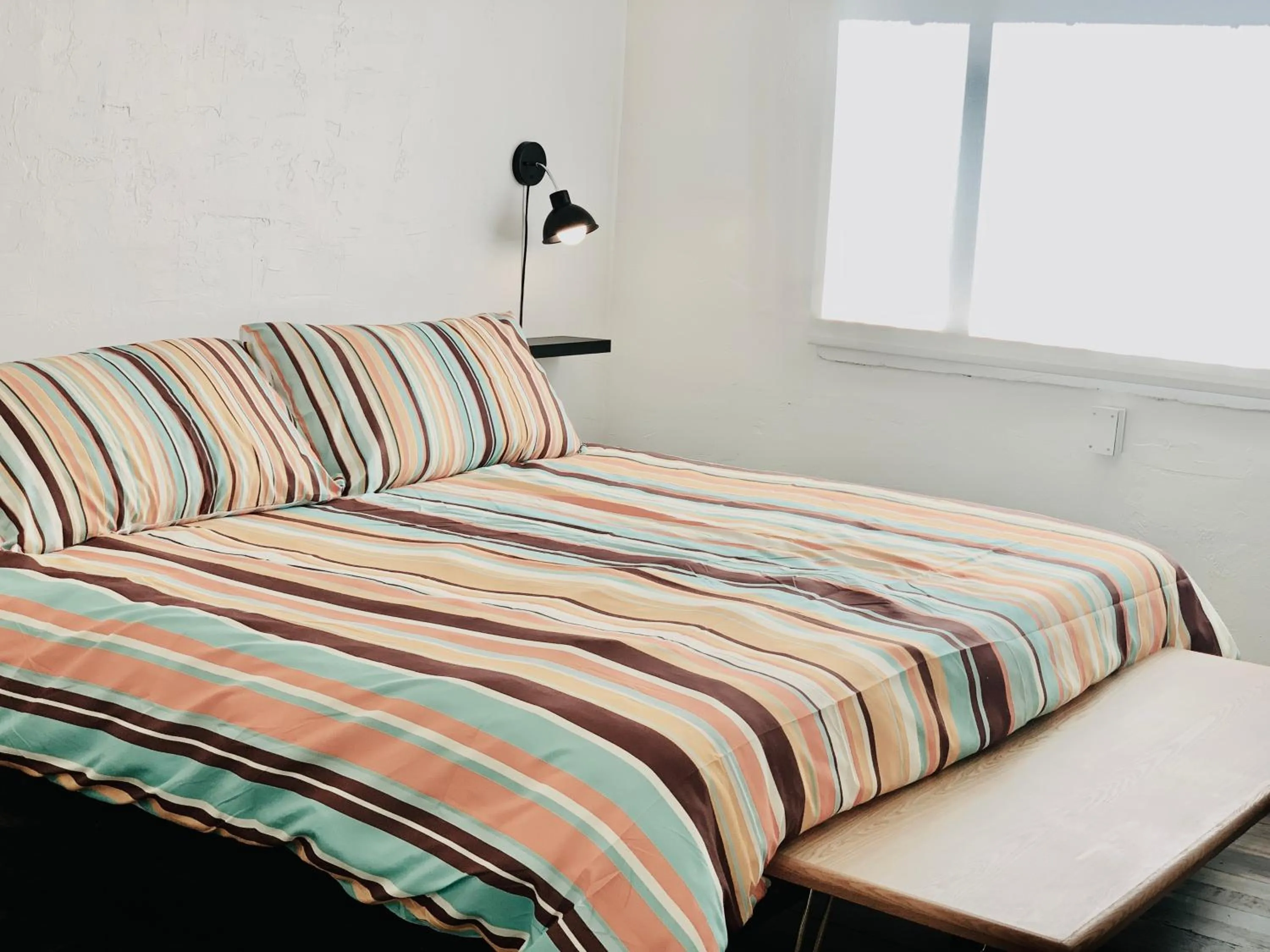 Bed in Dragonfly Motor Lodge