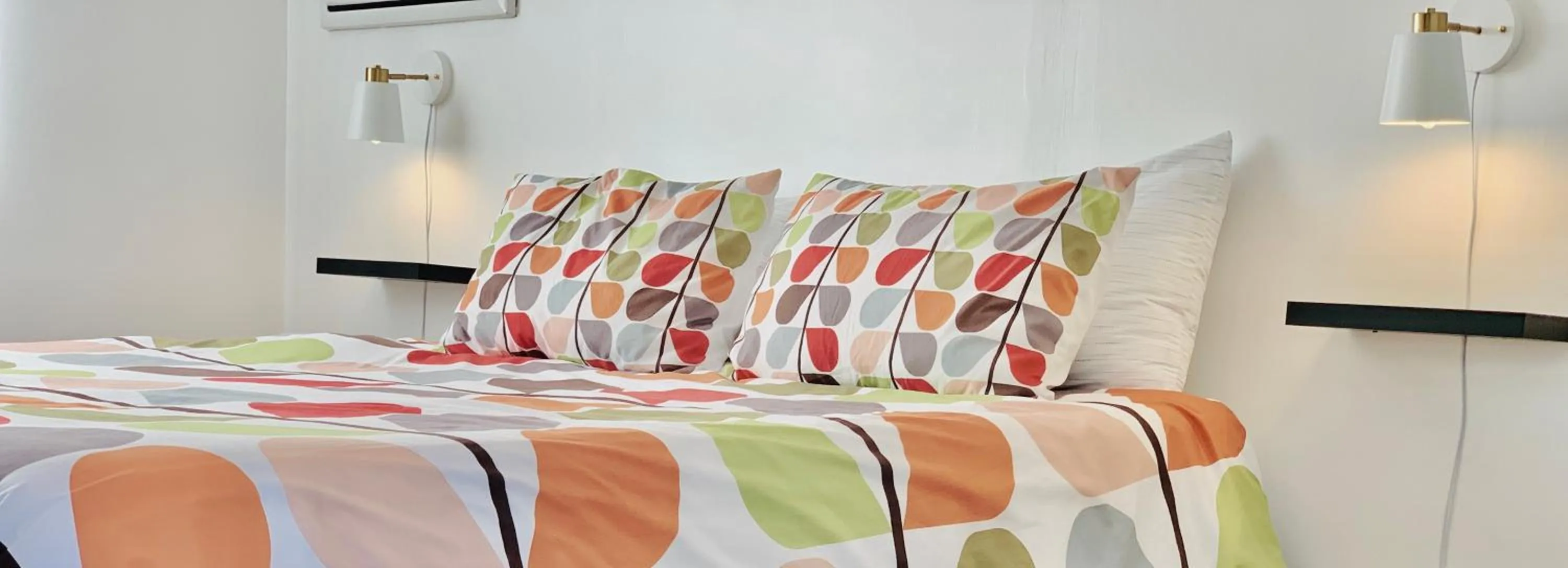 Bed in Dragonfly Motor Lodge