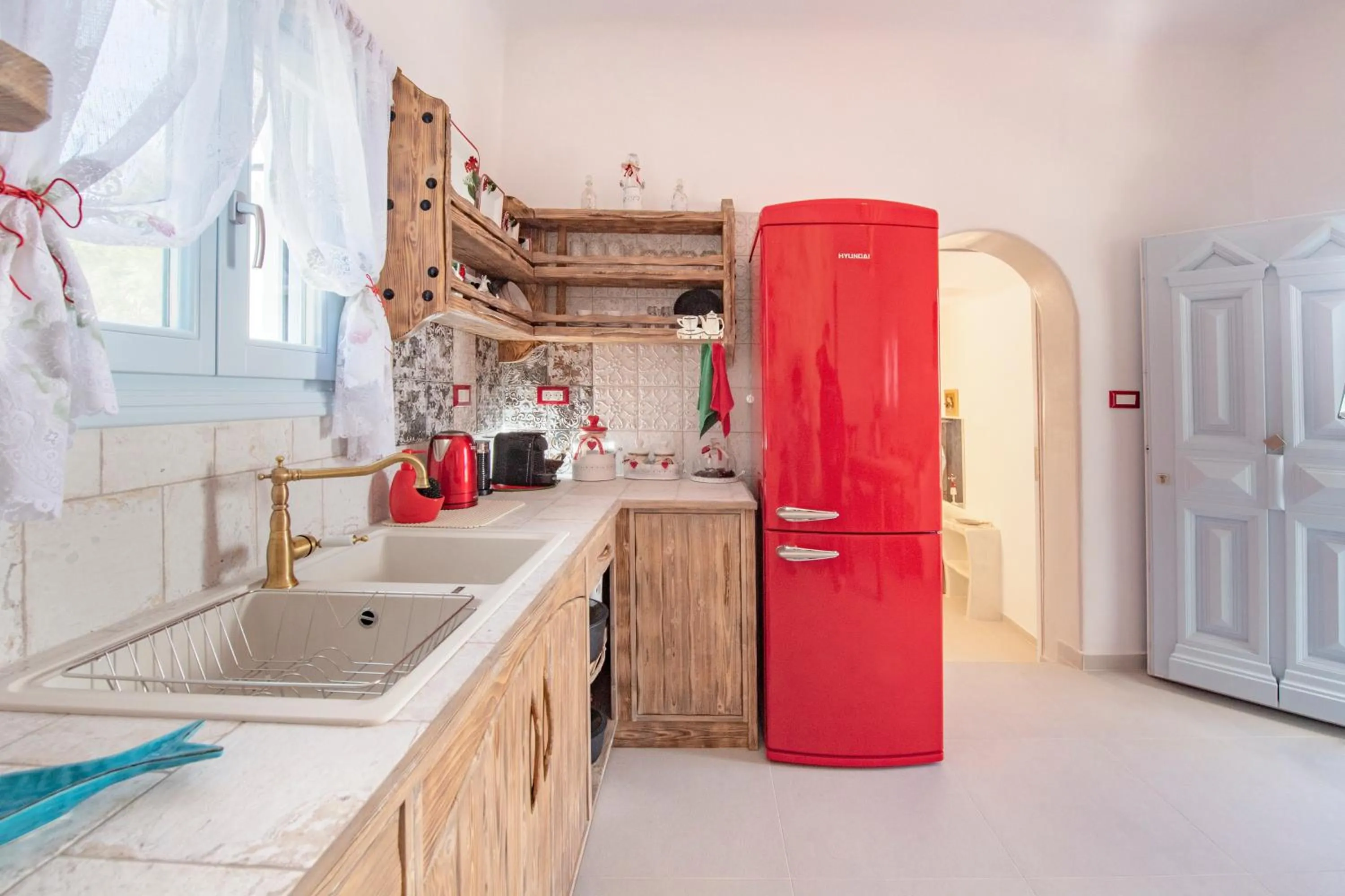 Kitchen or kitchenette in Starlight Luxury Seaside Villa & Suites