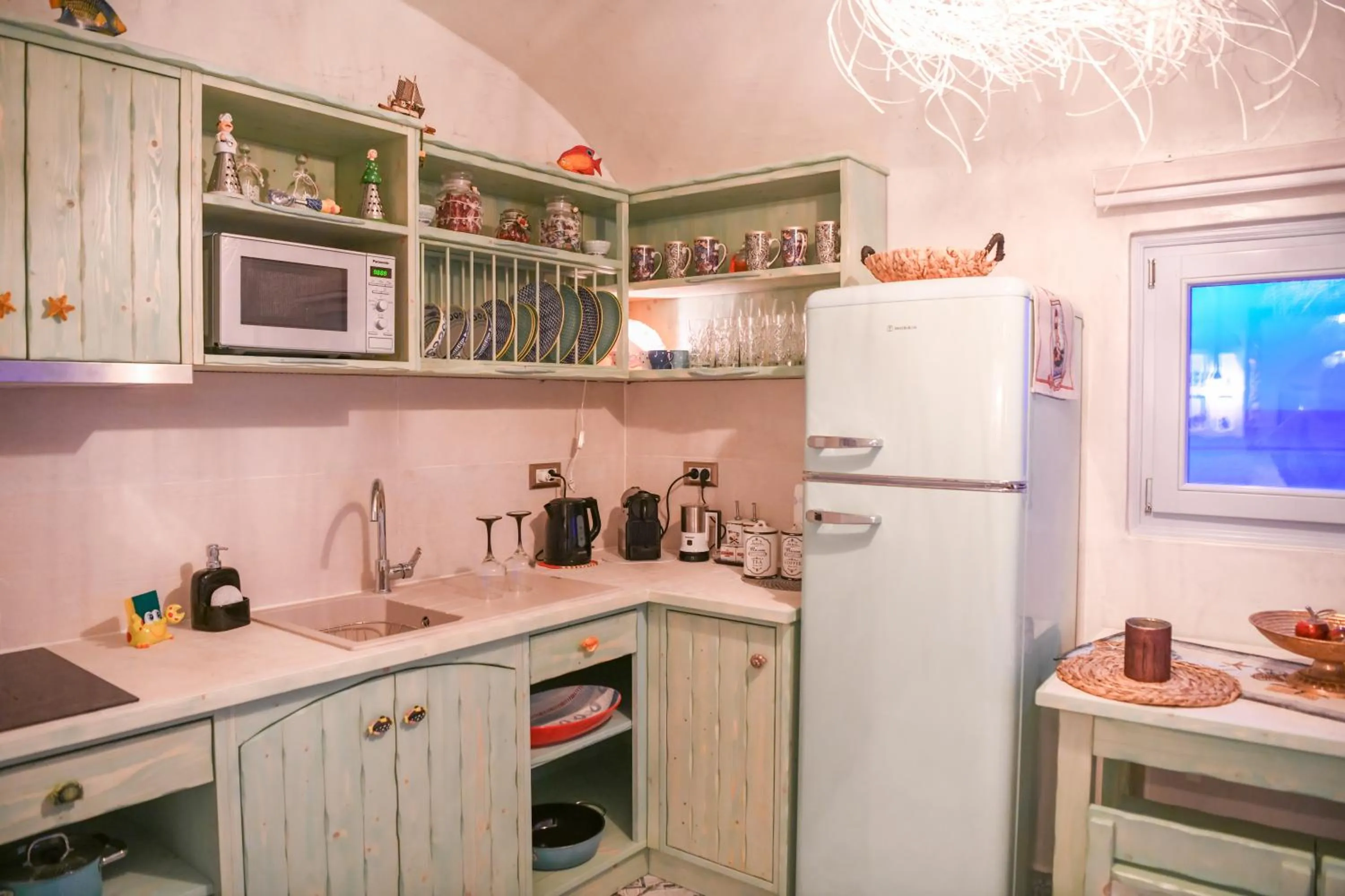 Communal kitchen in Starlight Luxury Seaside Villa & Suites