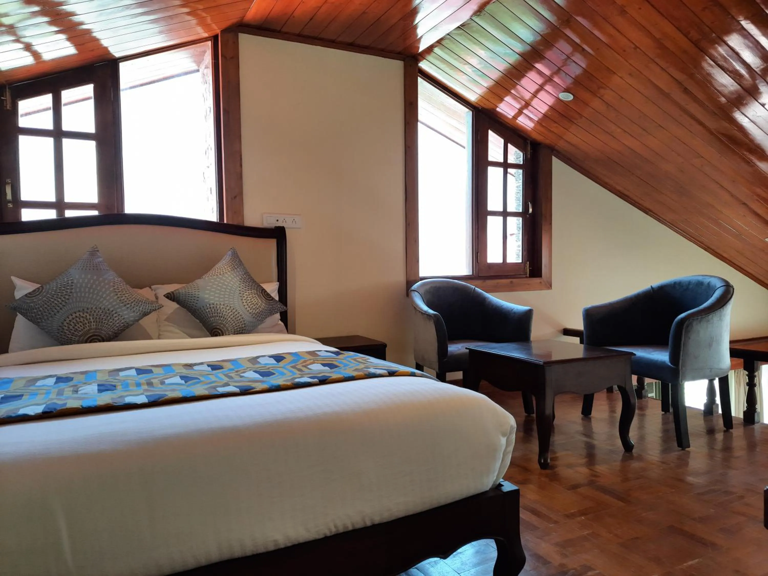 Bed in Regenta Inn by Riverside Manali