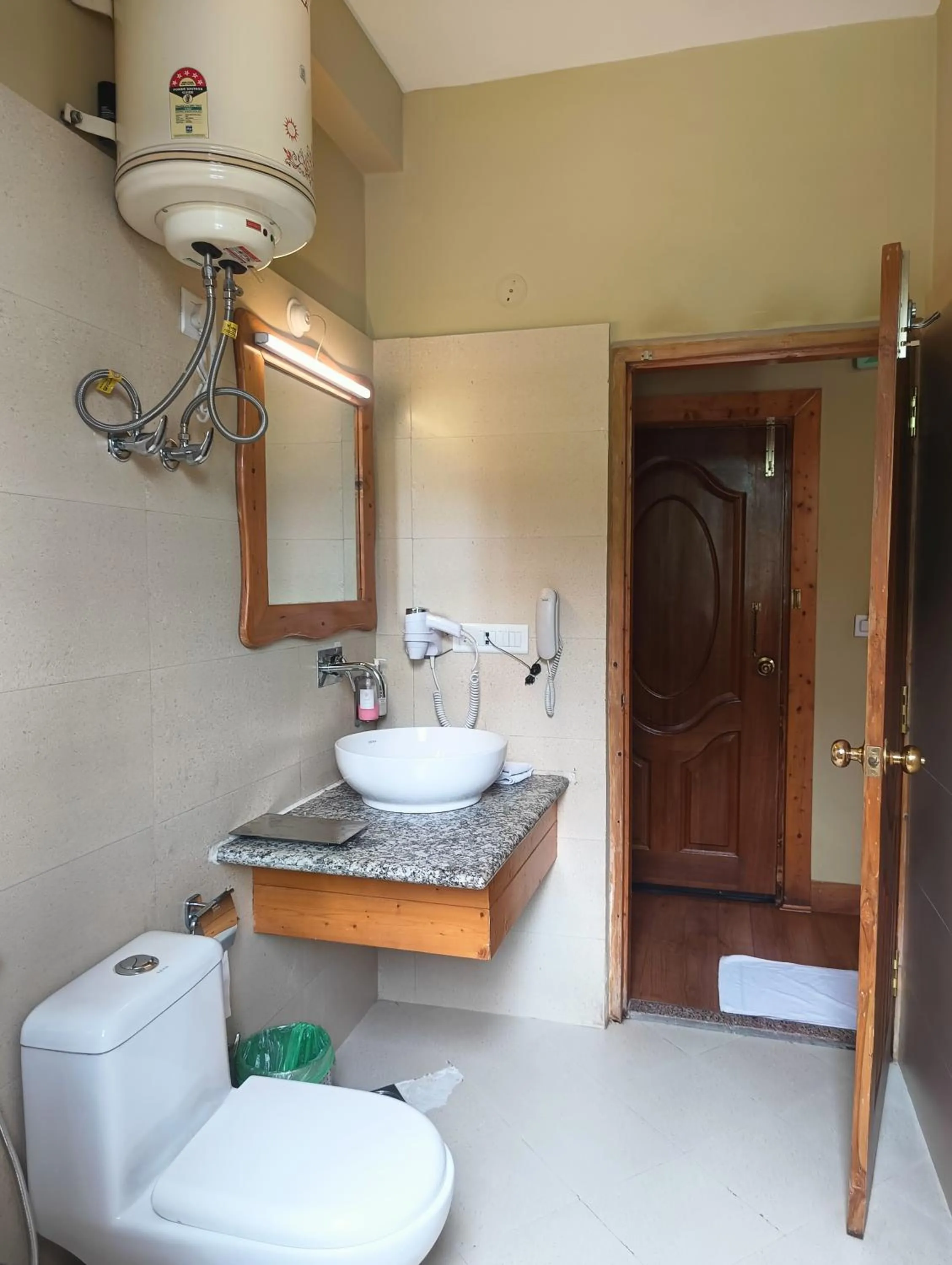 Bathroom in Regenta Inn by Riverside Manali