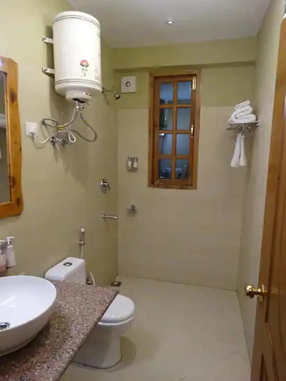 Bathroom in Regenta Inn by Riverside Manali