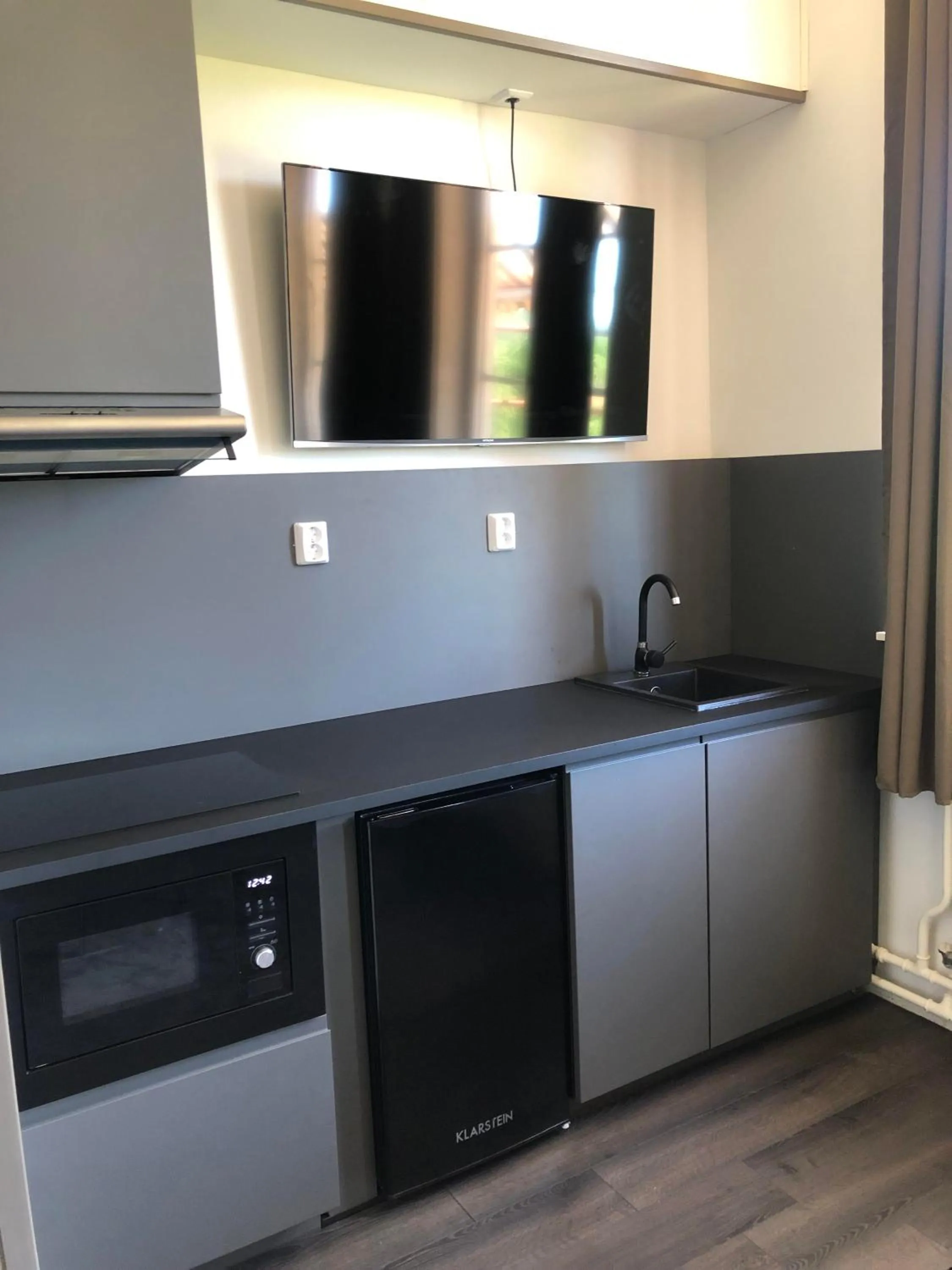 Kitchen or kitchenette in Sjugare Gård Bed & Breakfast