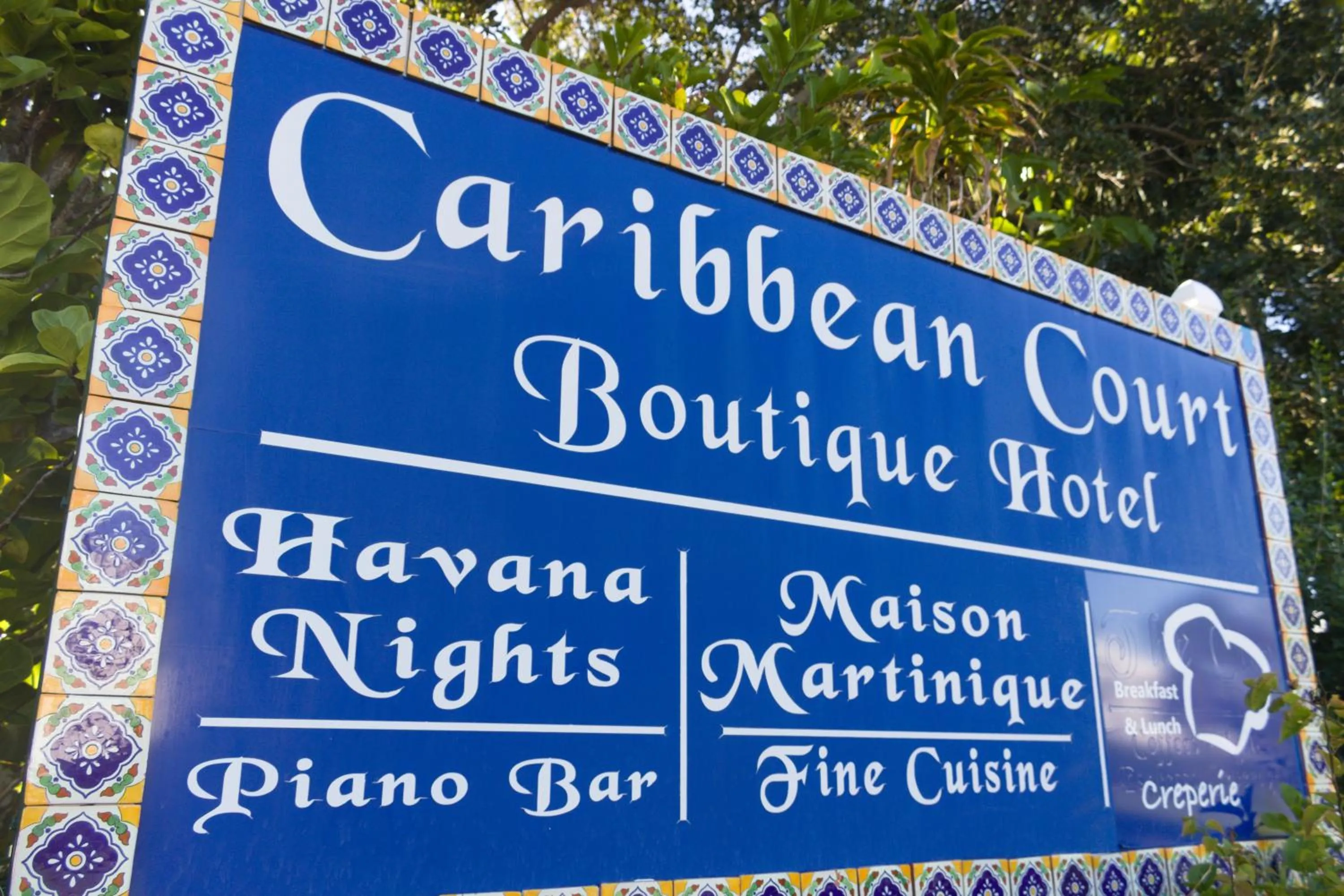 Property logo or sign in The Caribbean Court Boutique Hotel