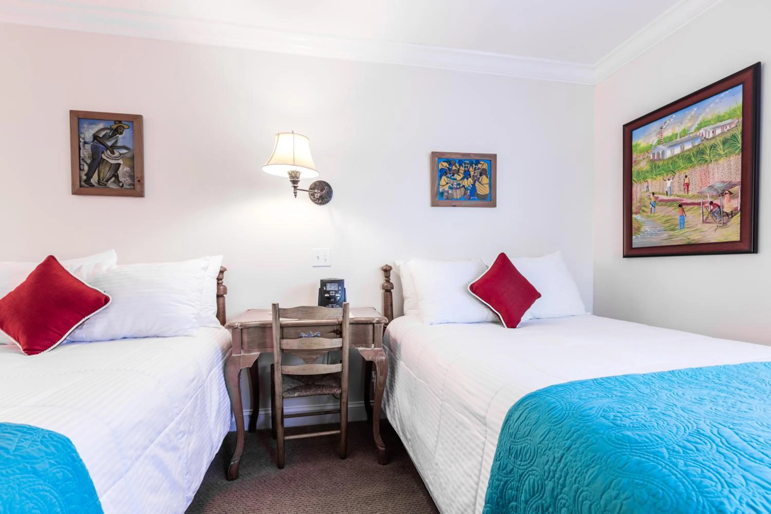 Bed in The Caribbean Court Boutique Hotel