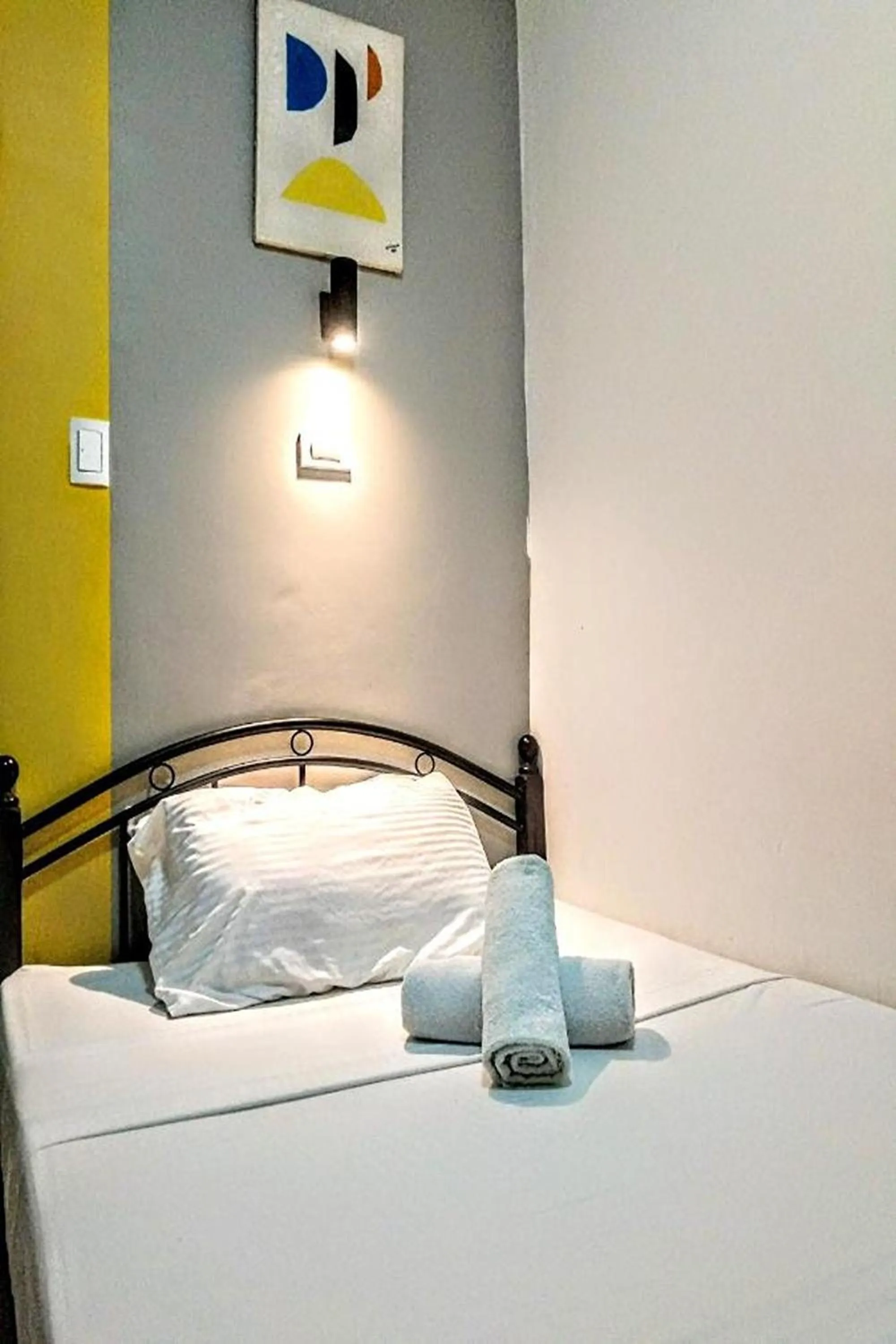 Bed in Hometel Barrio House Mactan