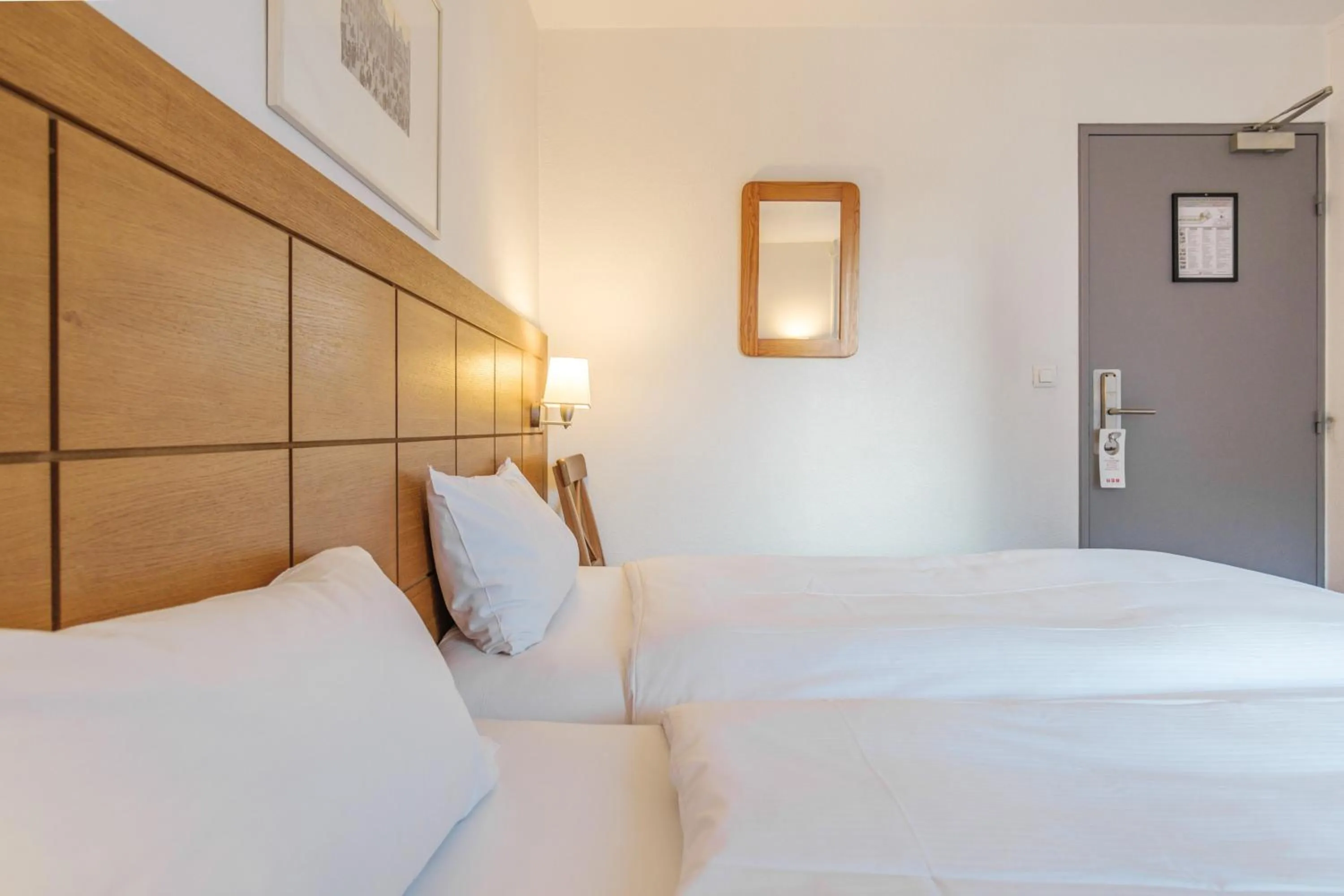 Bedroom, Bed in Hotel Strasbourg - Montagne Verte & Restaurant Louisiane