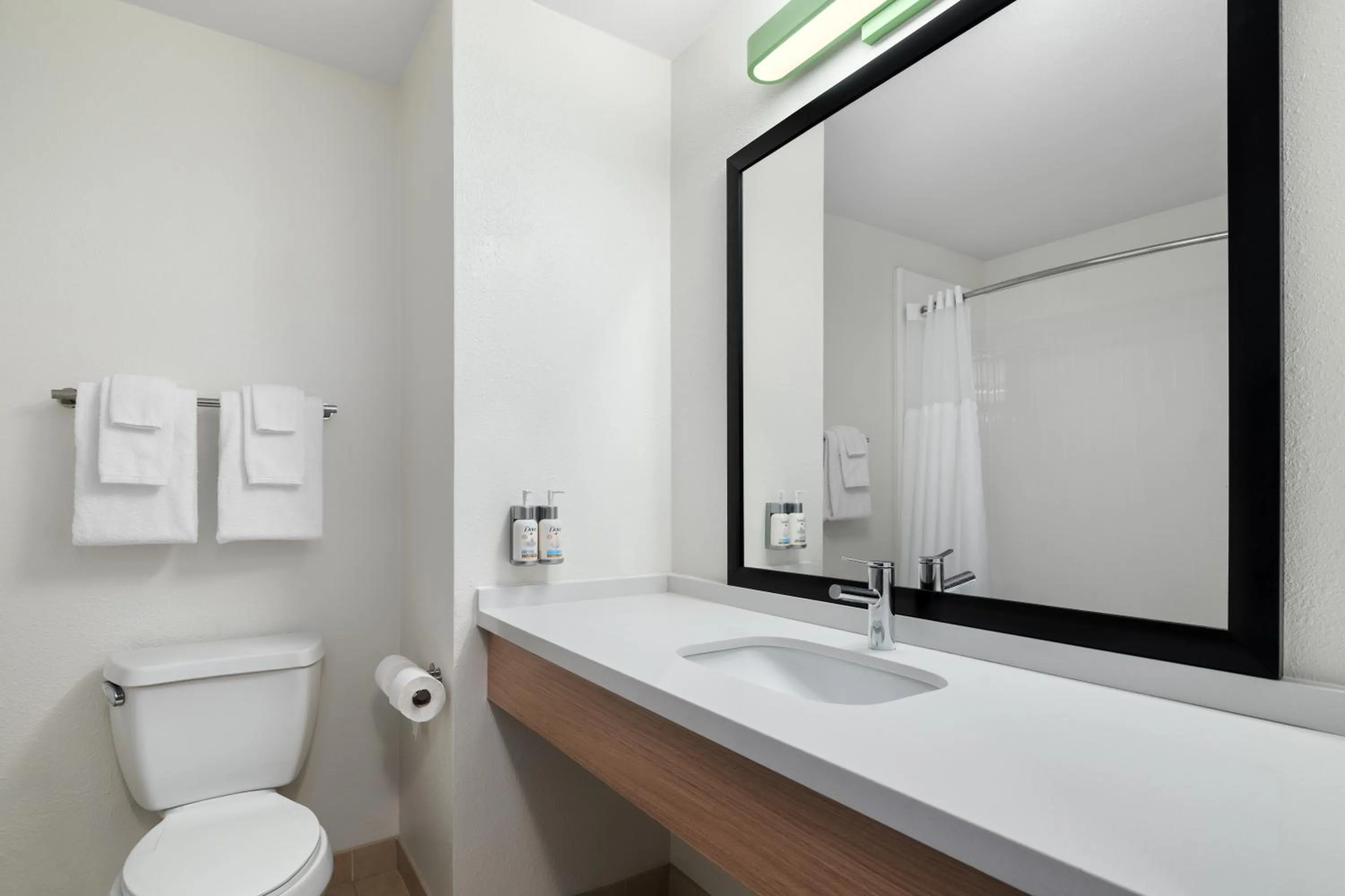 Shower in Garner Hotel Madison - Huntsville Airport by IHG