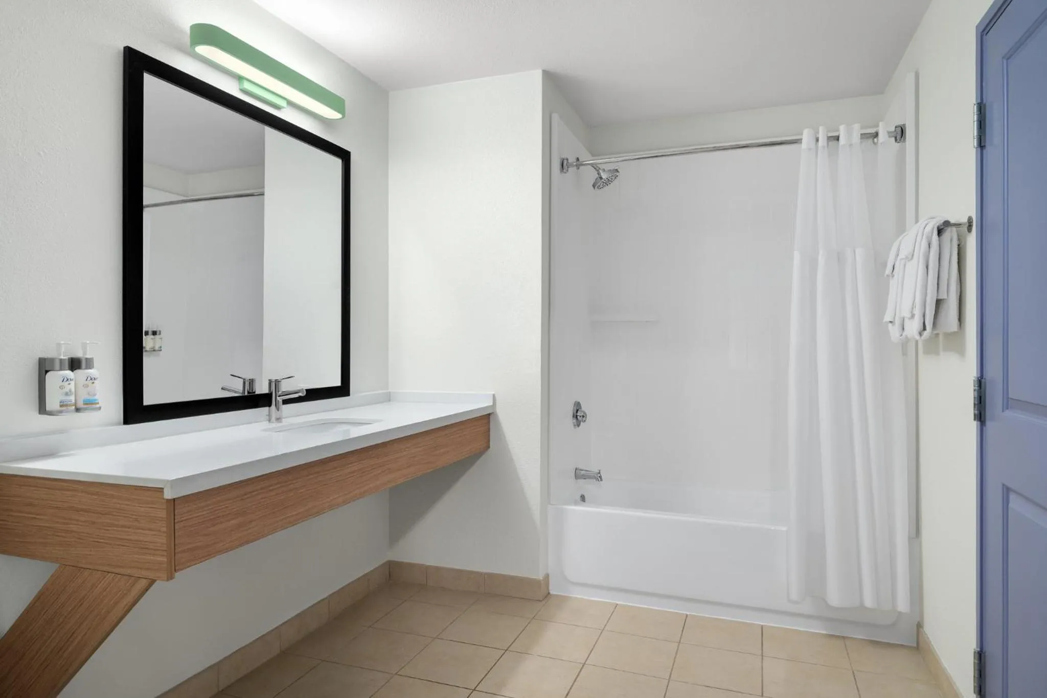 Bathroom in Garner Hotel Madison - Huntsville Airport by IHG