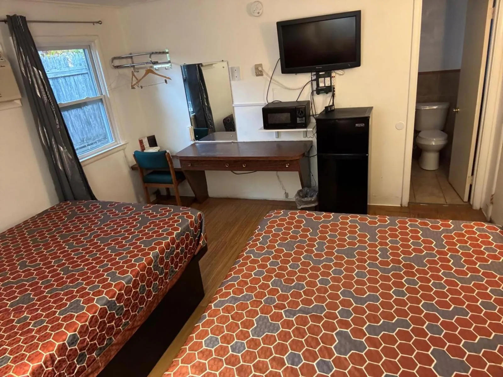 Bedroom, Bed in Economy Inn Cadillac MI by Hotel O