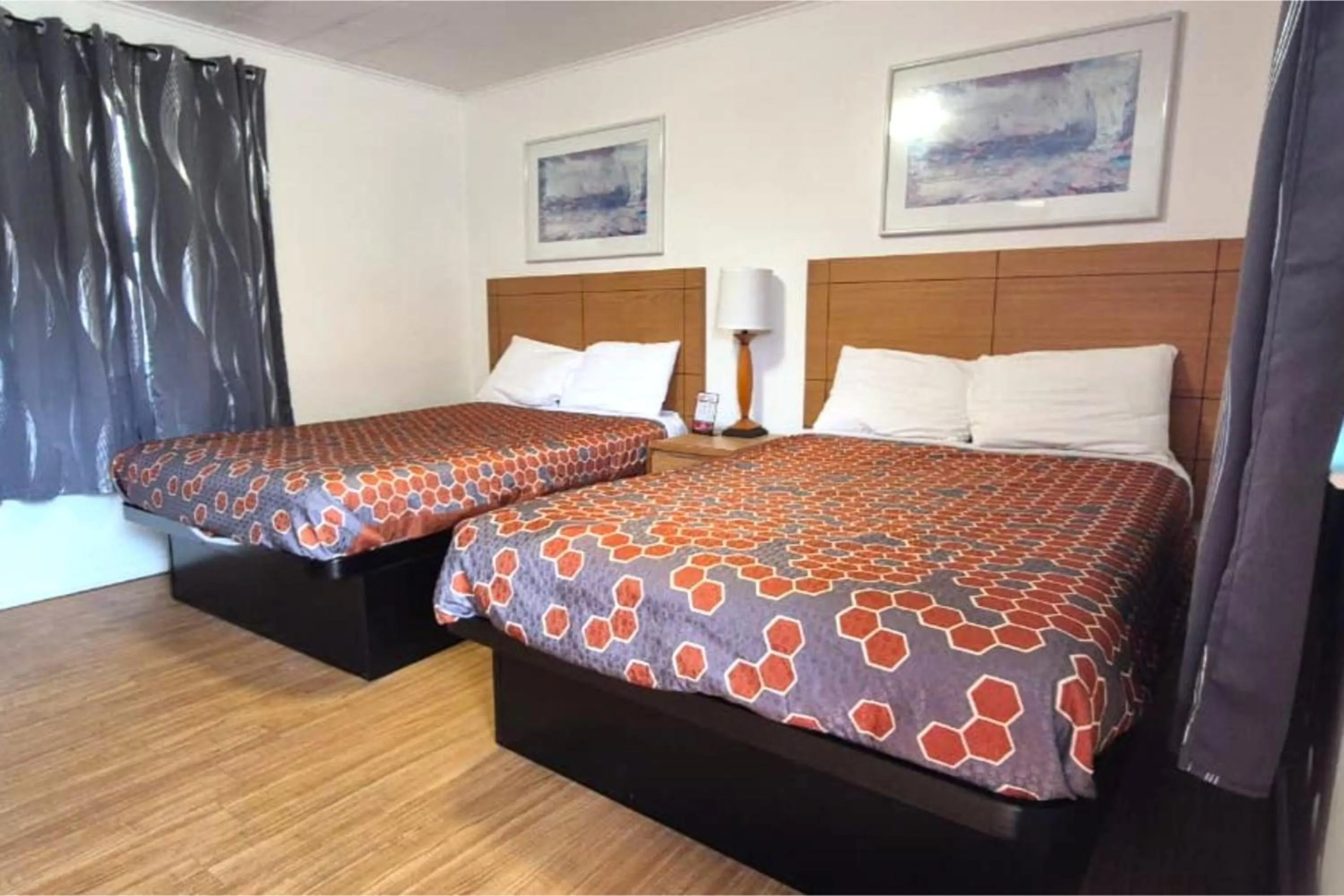 Bedroom, Bed in Economy Inn Cadillac MI by Hotel O