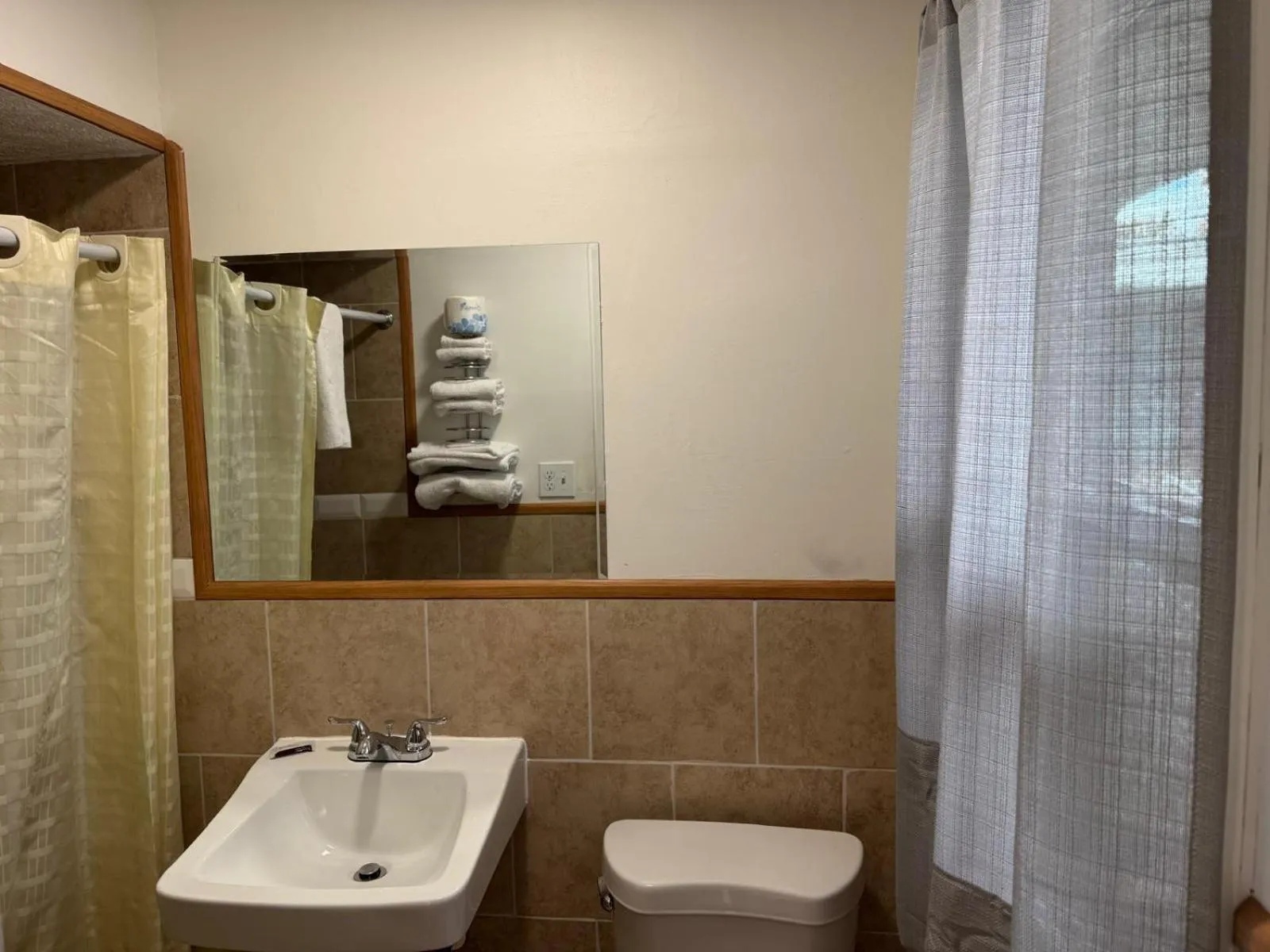 Bathroom in Economy Inn Cadillac MI by Hotel O