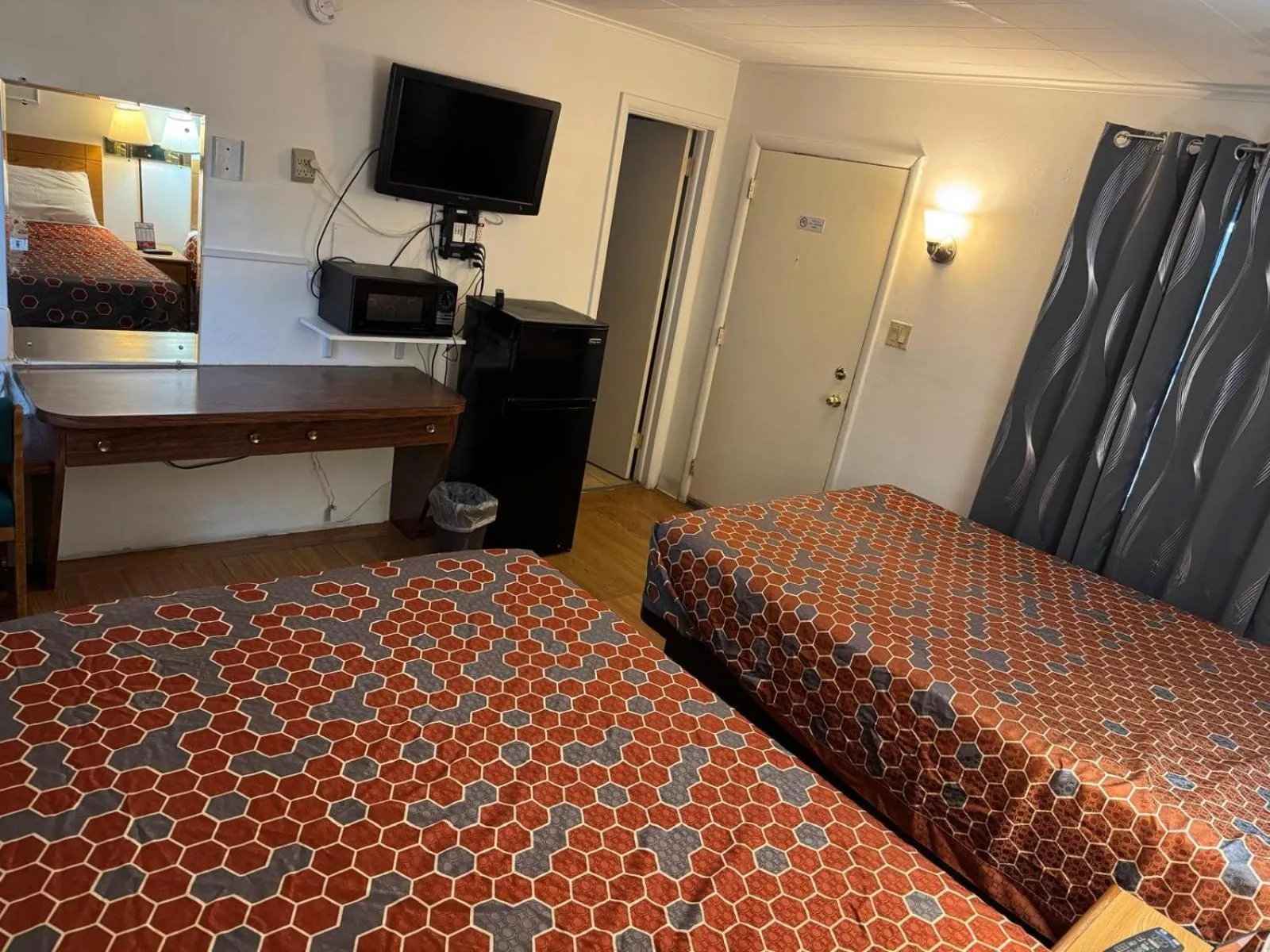 Bedroom, Bed in Economy Inn Cadillac MI by Hotel O