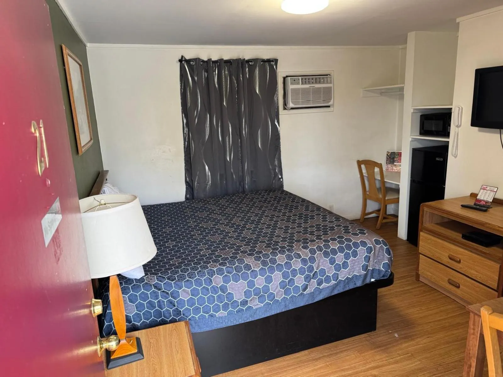 Bedroom, Bed in Economy Inn Cadillac MI by Hotel O