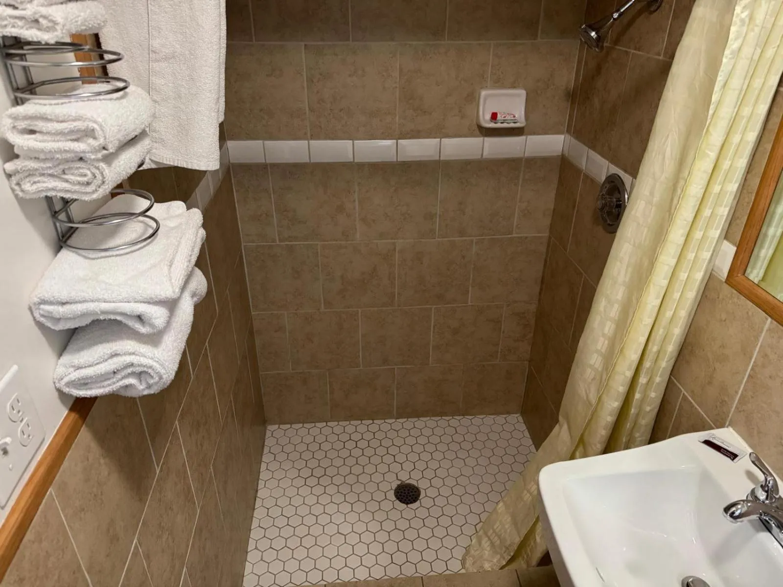 Bathroom in Economy Inn Cadillac MI by Hotel O