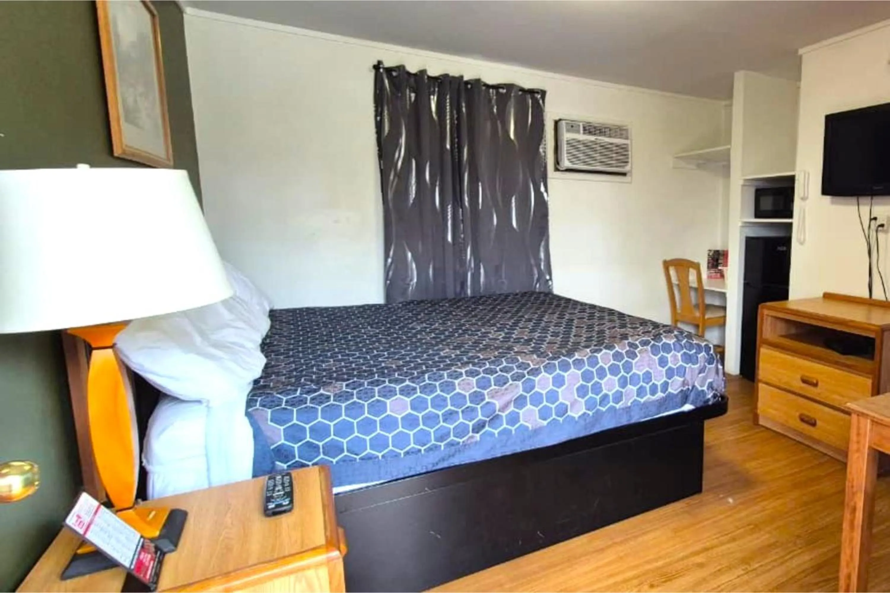 Bedroom, Bed in Economy Inn Cadillac MI by Hotel O