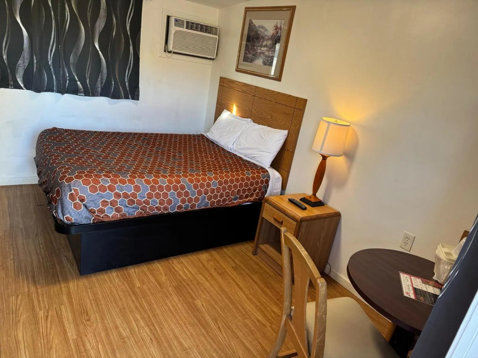 Bedroom, Bed in Economy Inn Cadillac MI by Hotel O