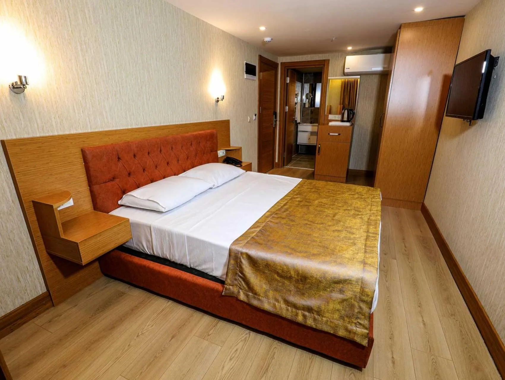 Bed in Grand Elmira Suites