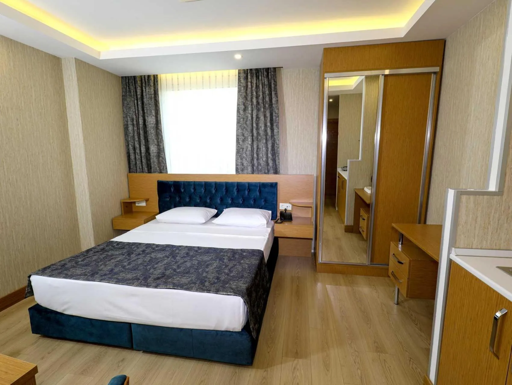 Bed in Grand Elmira Suites