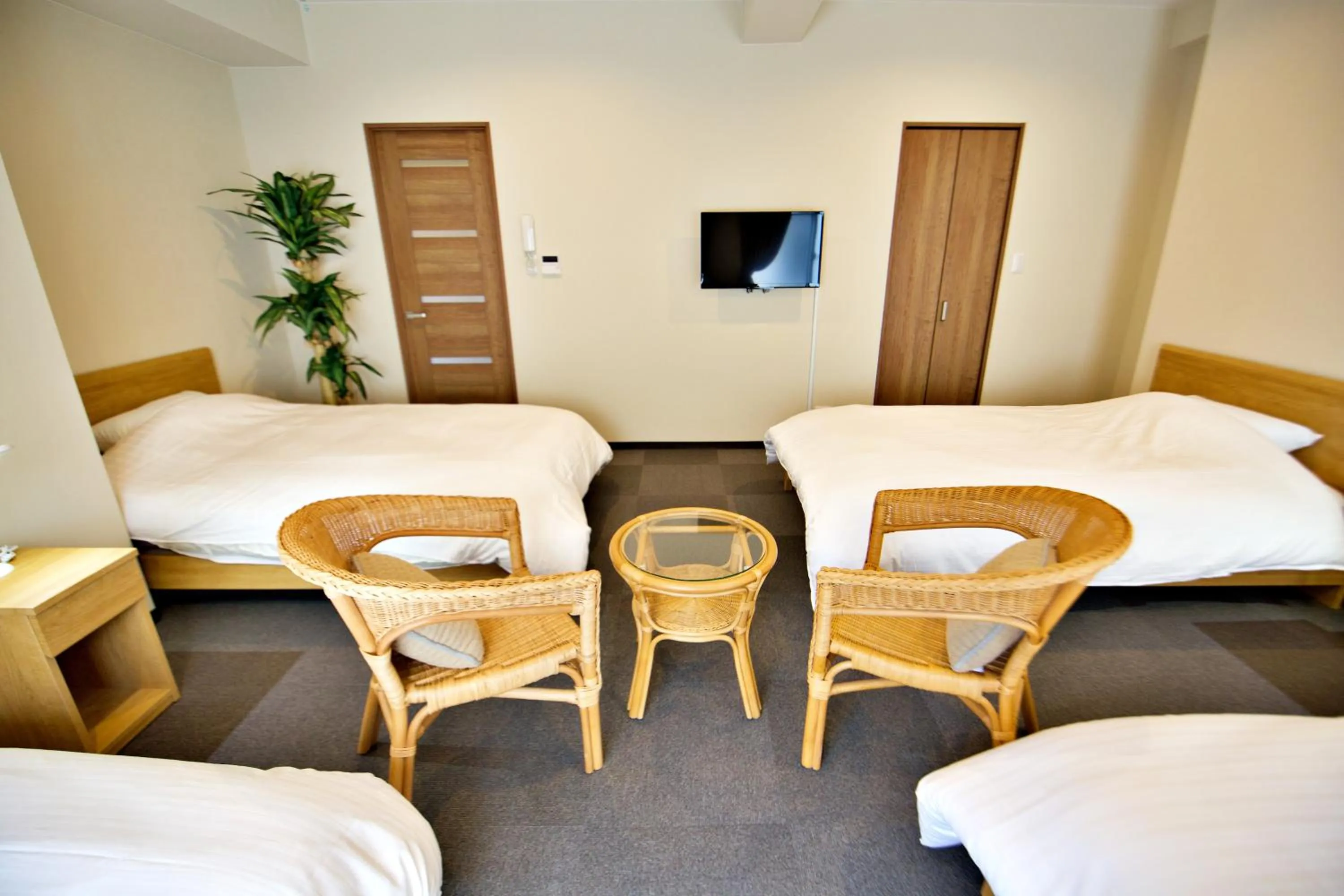 Bed in KURA HOTEL IZUMISANO