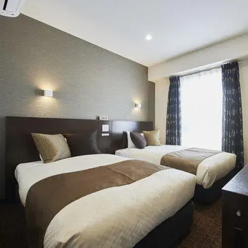 Bed in The Celecton Omiya Kaisoku Kitamoto Ekimae Bed in The Celecton Omiya Kaisoku Kitamoto Ekimae